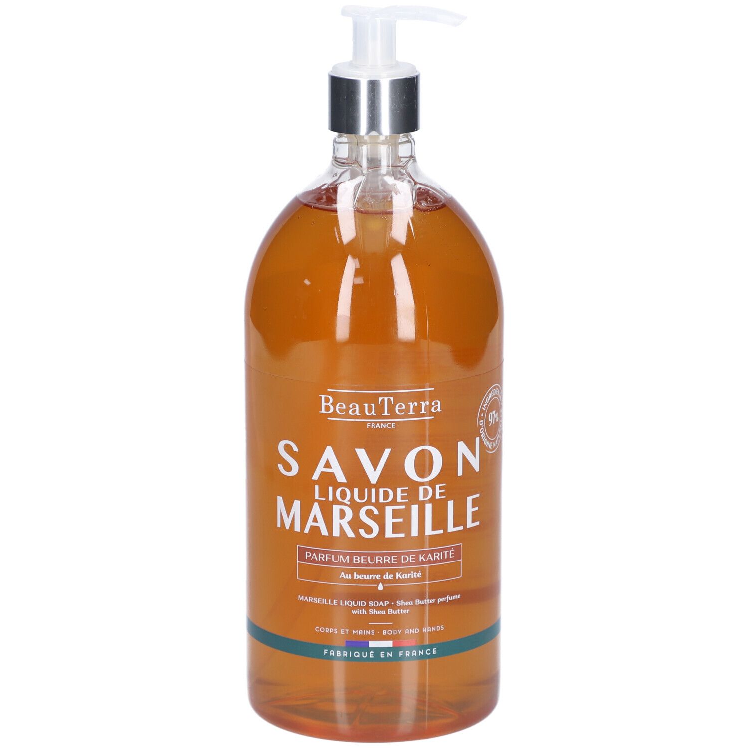 Vloeibare zeep in een transparante fles met pomp. Opschrift: Savon Liquide de Marseille, Parfum beurre de Karité.