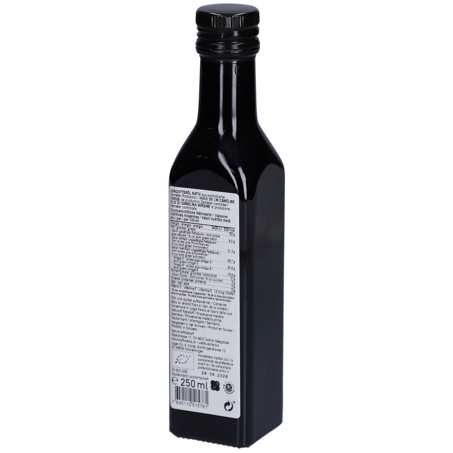 Achterkant van een donkere glazen fles met gedetailleerde productinformatie en voedingswaarden. Demeter- en bio-zegel.