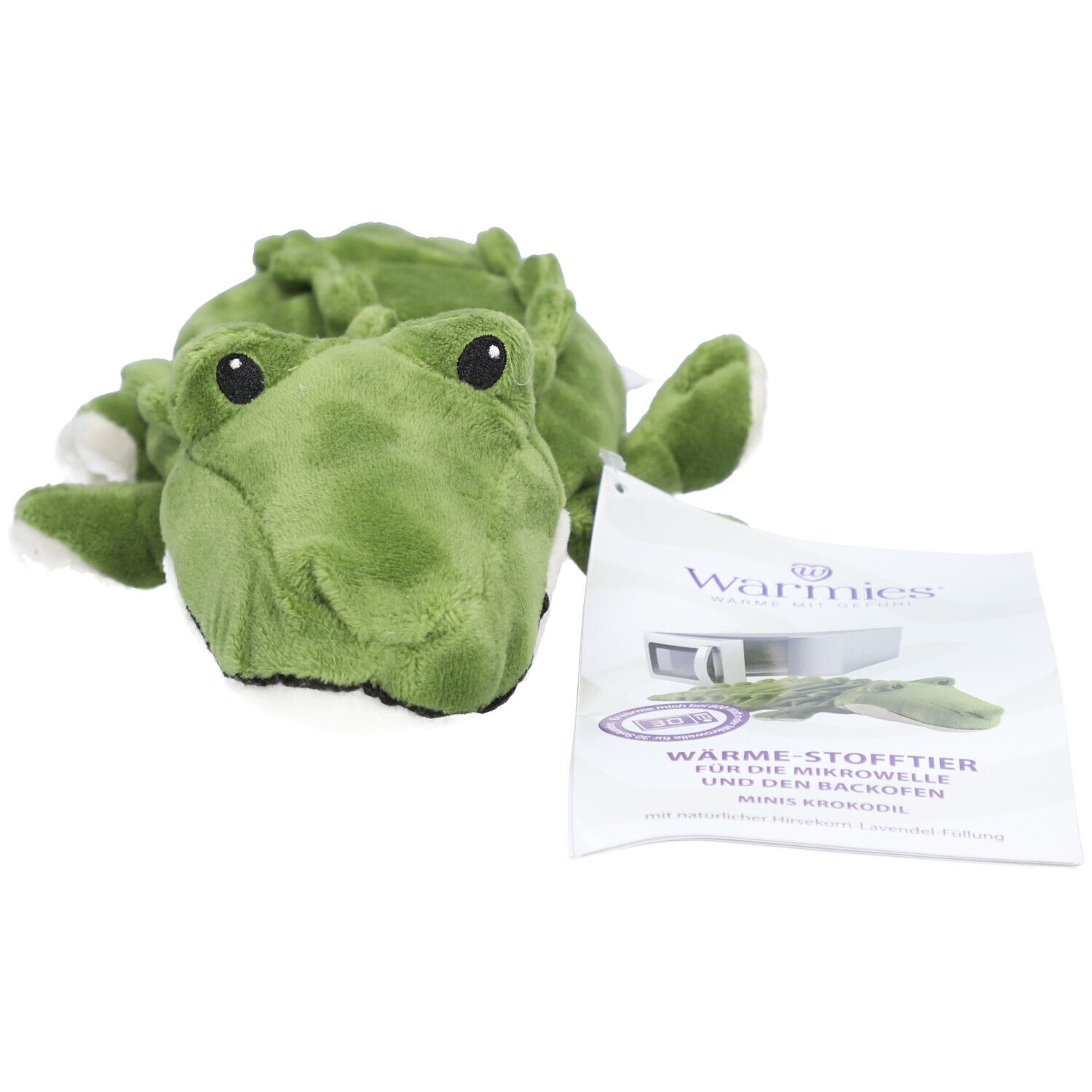 Peluche crocodile vert. Yeux noirs. Étiquette avec informations sur le produit.
