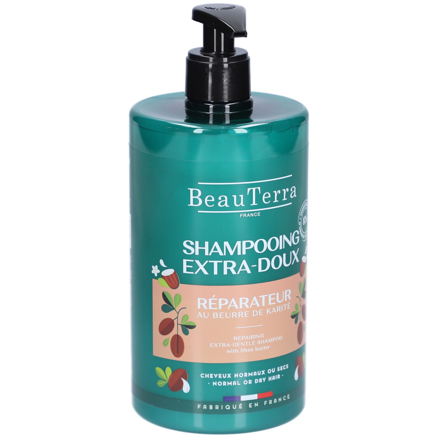 Groene shampoo fles met zwarte pomp. Opschrift: BeauTerra, Shampooing Extra-Doux, Réparateur au beurre de Karité. Voor normaal of droog haar.