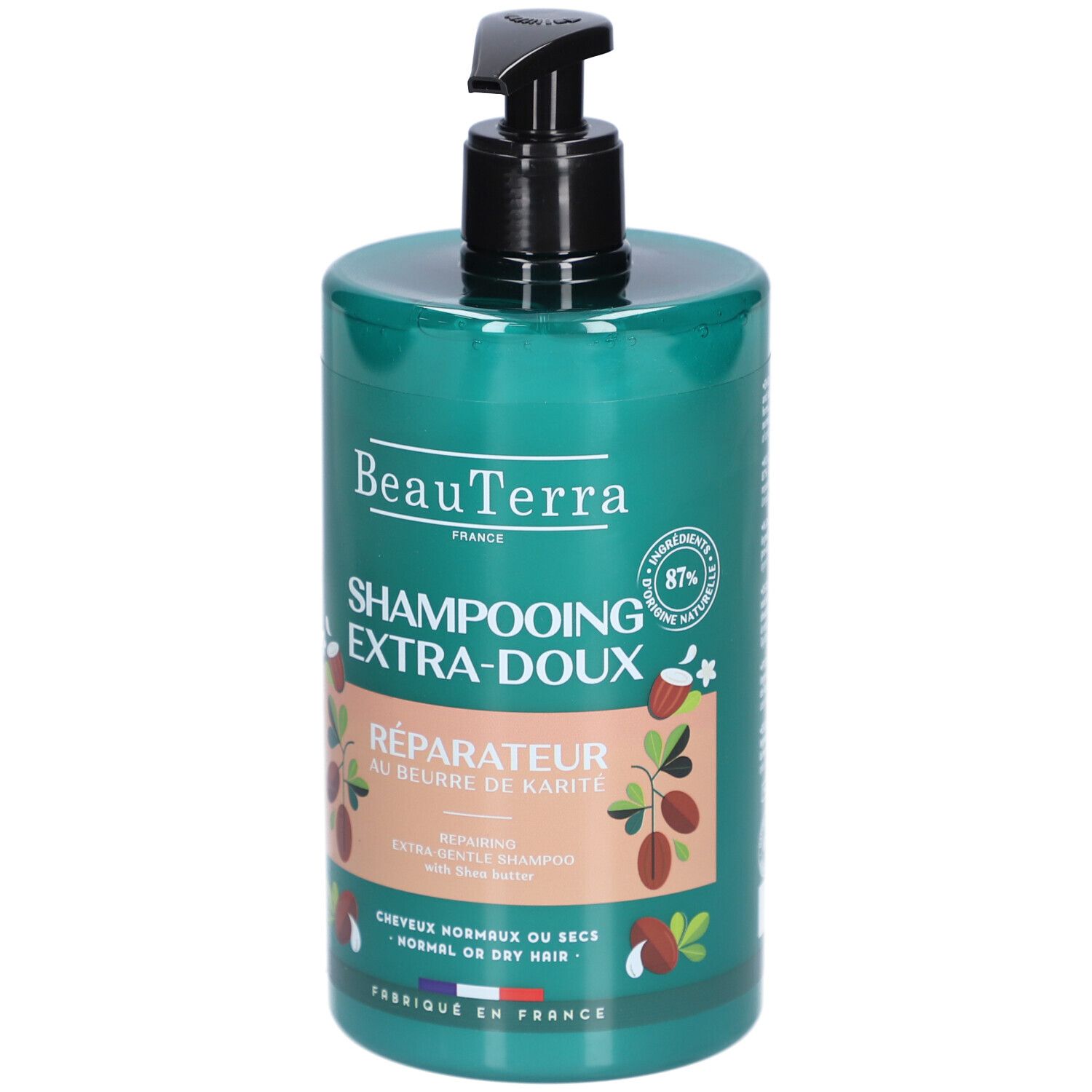 Groene shampoo fles met zwarte pomp. Opschrift: BeauTerra, Shampooing Extra-Doux, Réparateur au beurre de Karité. 87% natuurlijke ingrediënten.