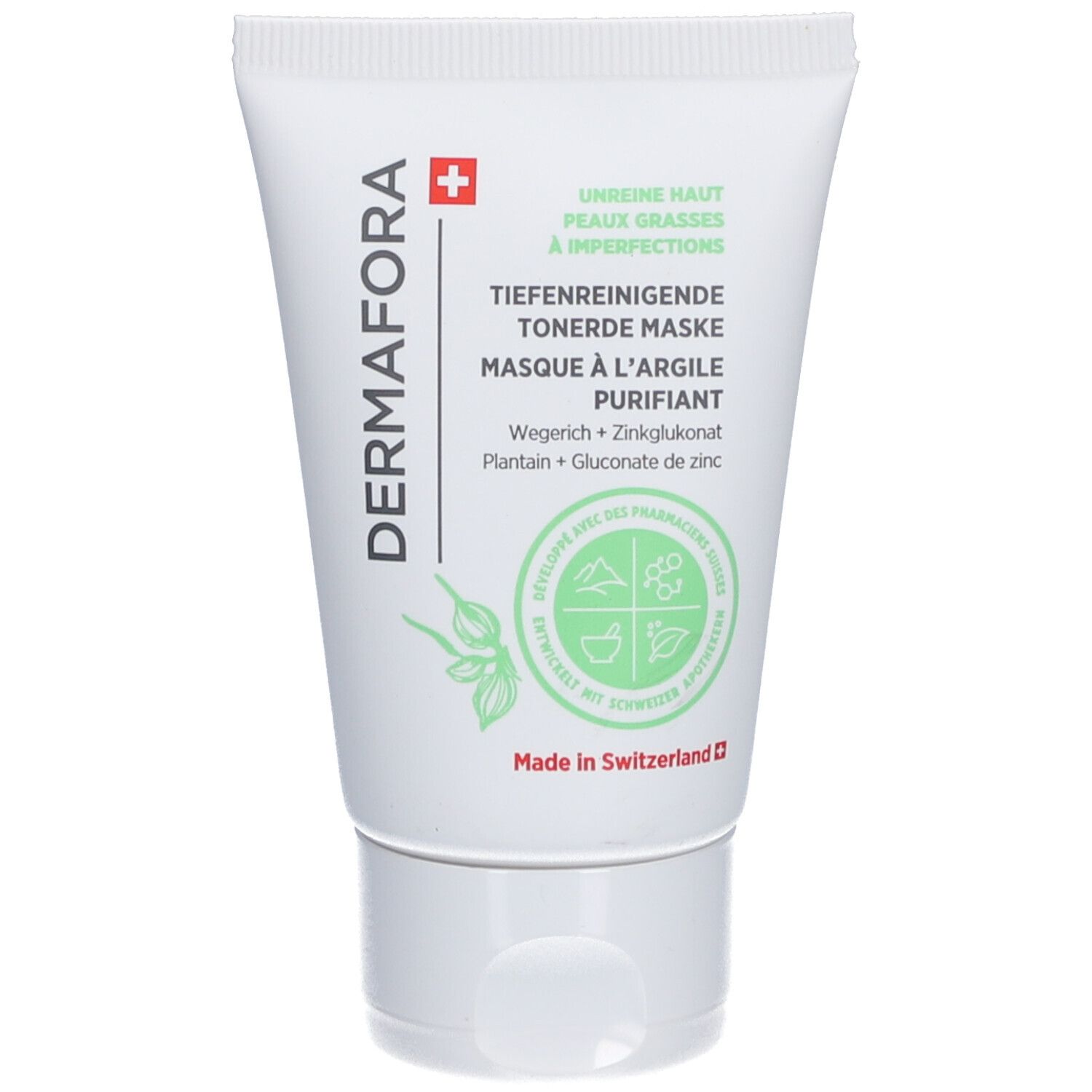 Witte tube met groene opdruk. Tekst: DERMAFORA, Diepreinigend kleimasker. Zwitsers kruis. Botanische illustraties.