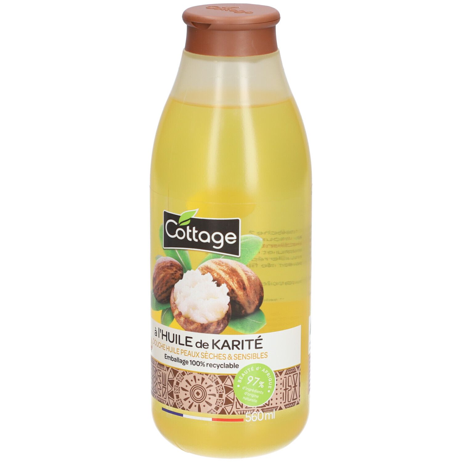Fles douche-olie met shea-olie. Afbeelding van shea-noten. Verpakking 100% recyclebaar. 560ml.