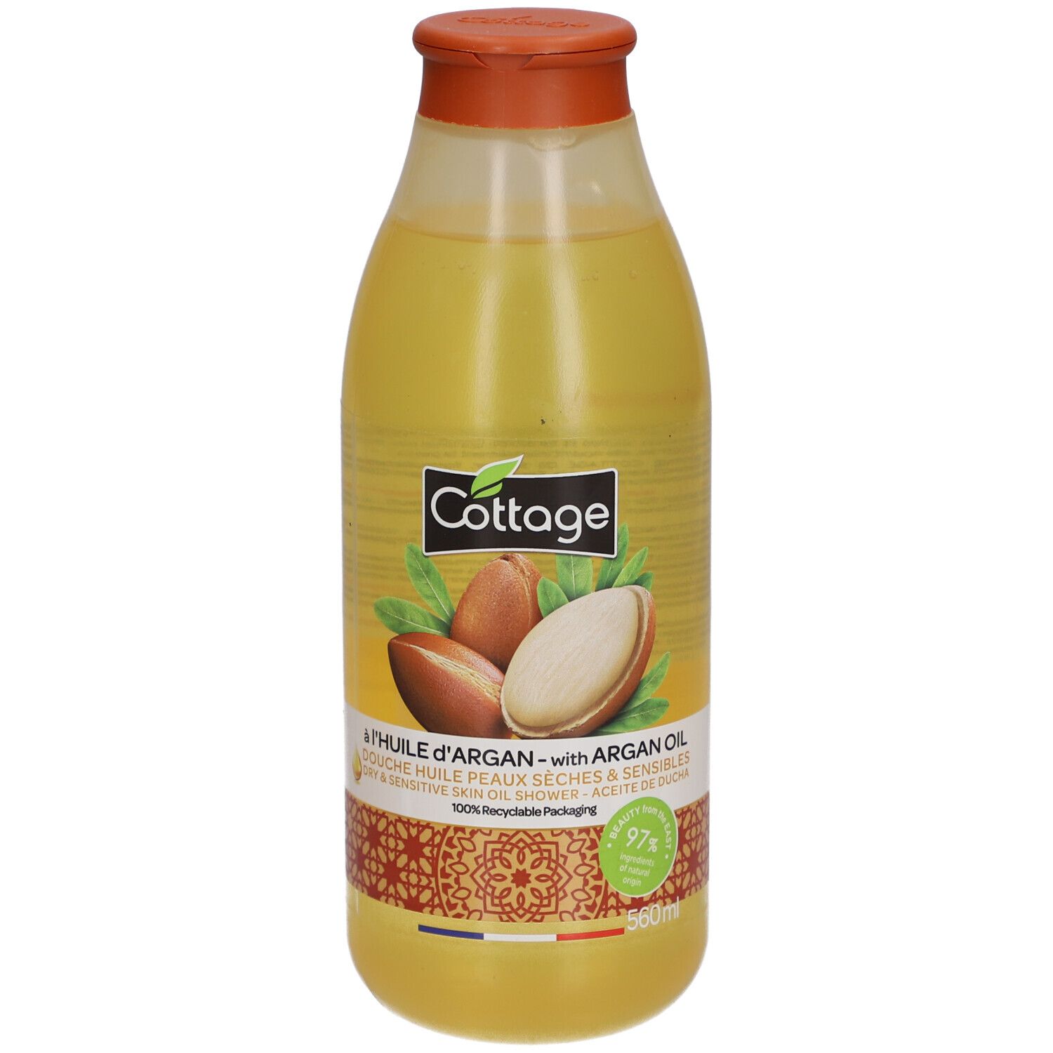 Cottage doucheolie met arganolie in een doorzichtige fles met oranje dop. Arganvruchten op het etiket.