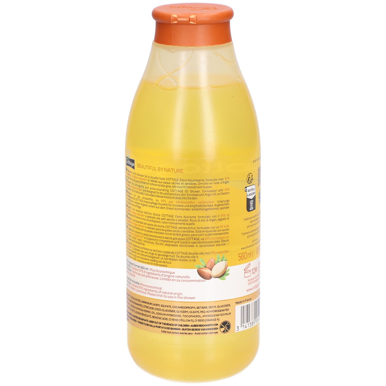 Achterkant van een Cottage doucheolie fles met gedetailleerde productinformatie en ingrediënten. Arganvruchten afgebeeld.