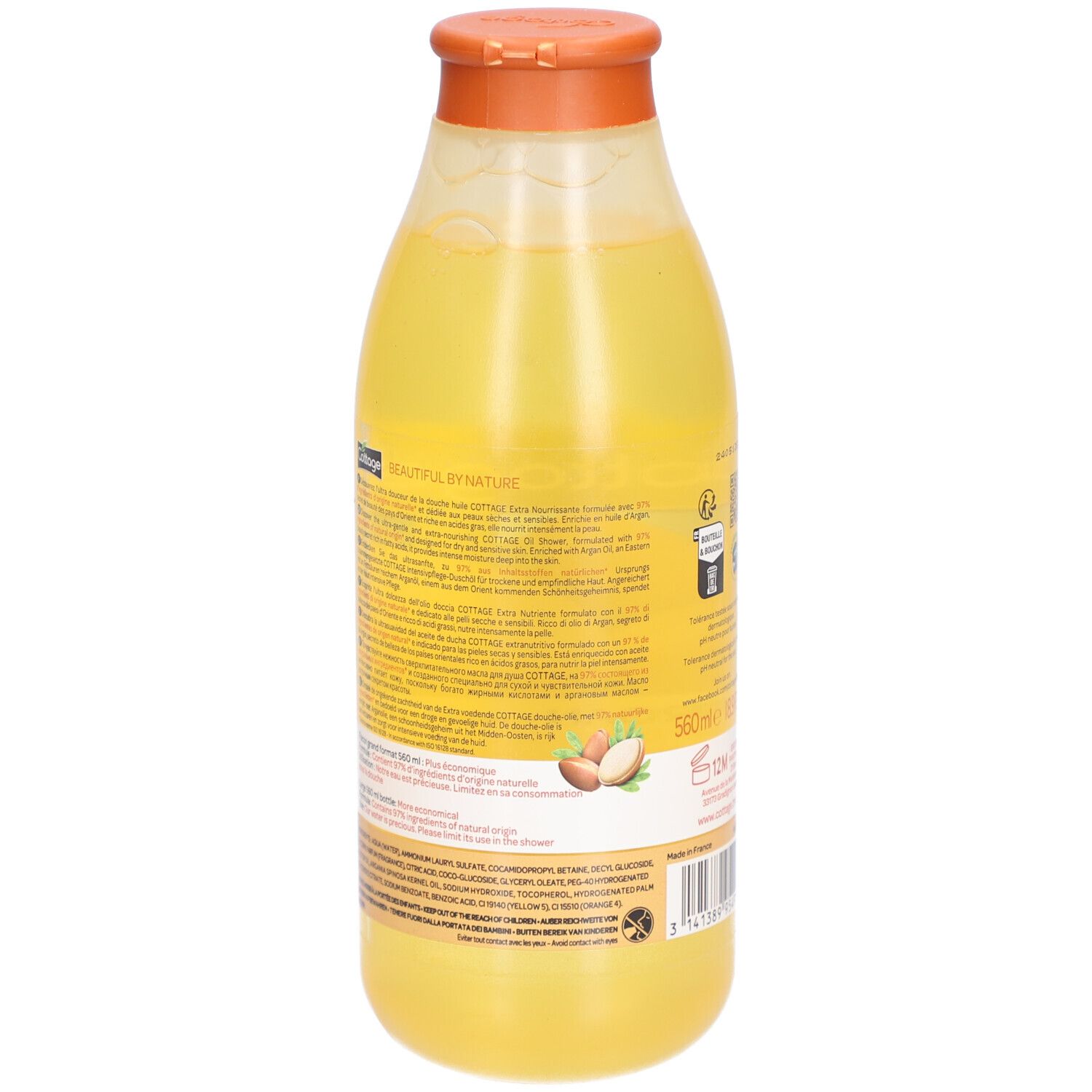 Achterkant van een Cottage doucheolie fles met gedetailleerde productinformatie en ingrediënten. Arganvruchten afgebeeld.