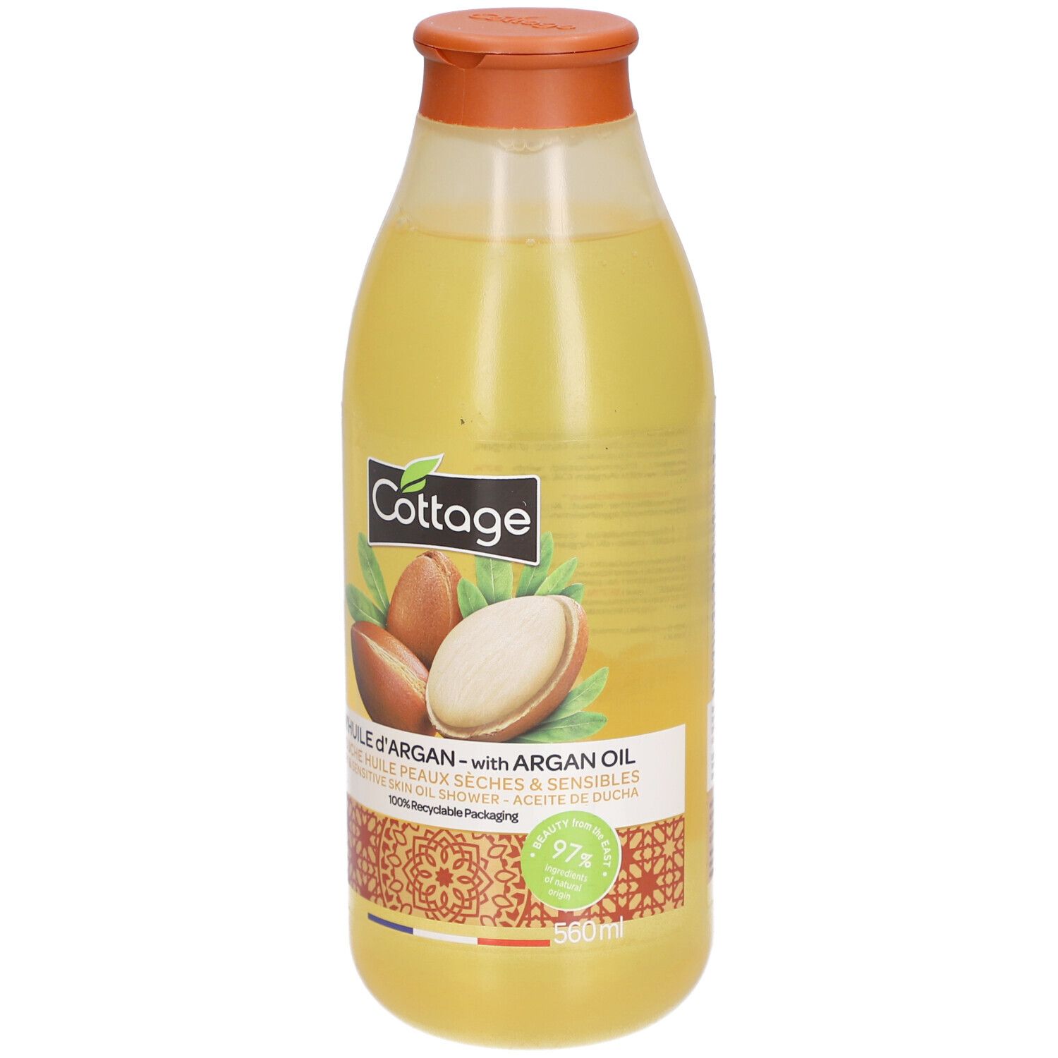 Gele fles met oranje dop. Opschrift: Cottage, arganolie. Illustratie van arganvruchten. 97% recyclebaar. 560ml.