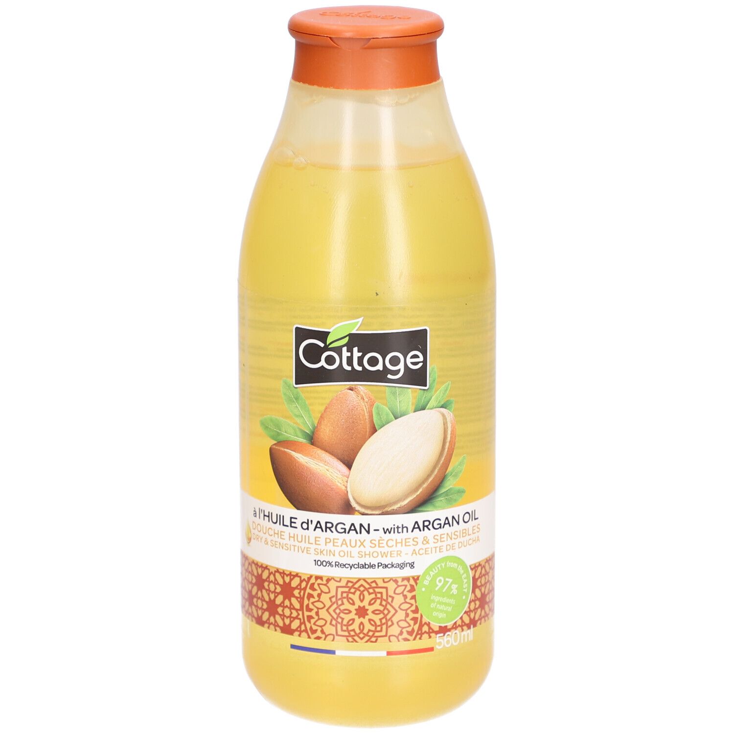 Cottage doucheolie met arganolie in een doorzichtige fles met oranje dop. Arganvruchten op het etiket.