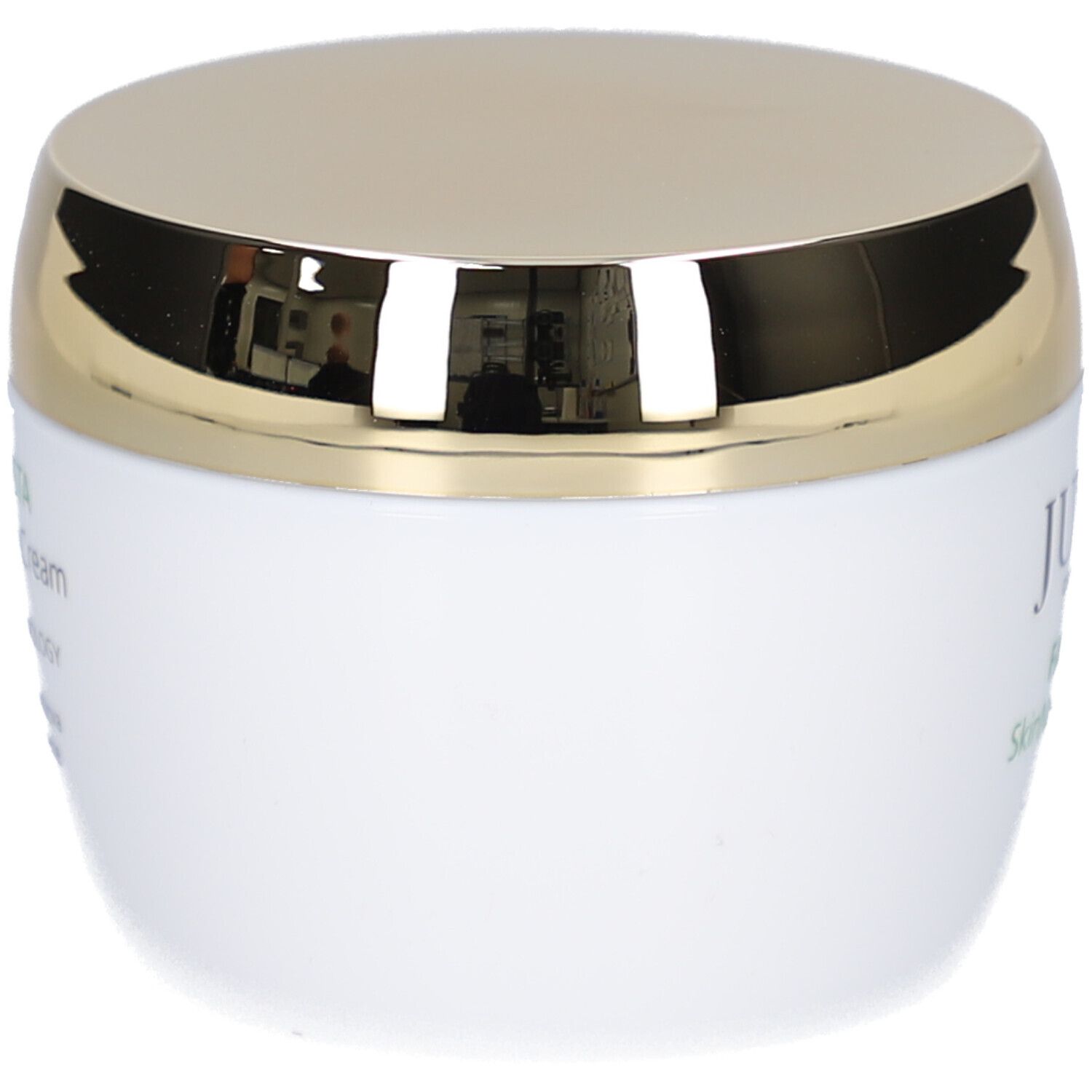 Pot de crème blanc avec couvercle doré. Inscription: Juvena, Fascionista SkinNova Body Cream.