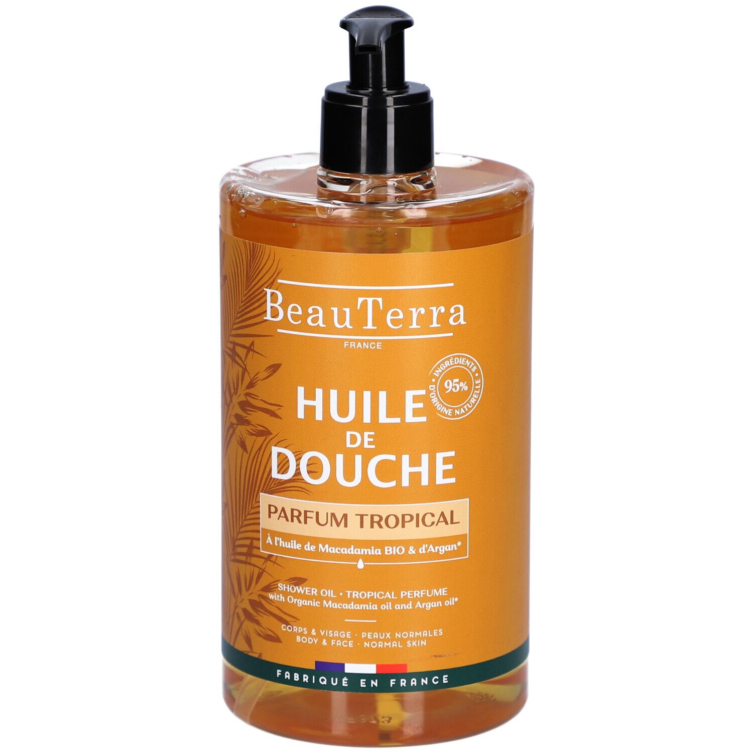 Transparante fles met zwarte pomp. Opschrift: "Huile de Douche Parfum Tropical".