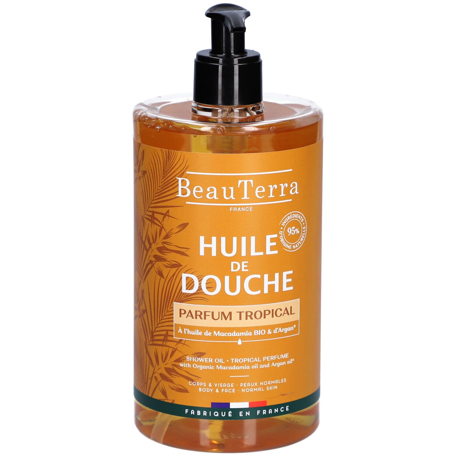 Transparante fles met zwarte pomp. Opschrift: "Huile de Douche Parfum Tropical".