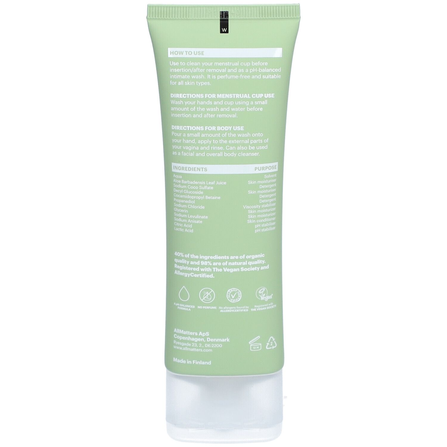 Dos du tube vert. Texte avec instructions et ingrédients. Logos Vegan et certification allergie.