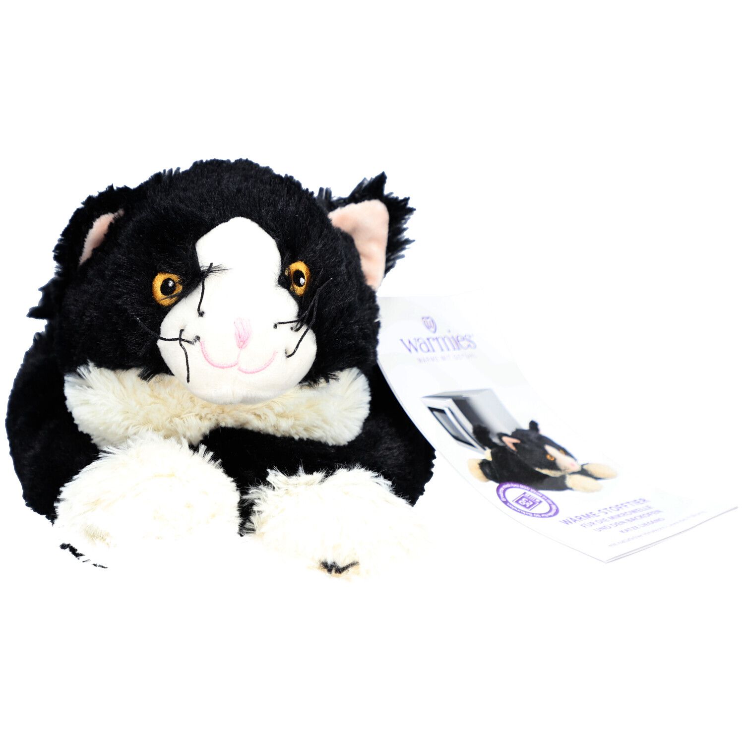Zwarte en witte pluche kat met label. Label toont "Warmies".
