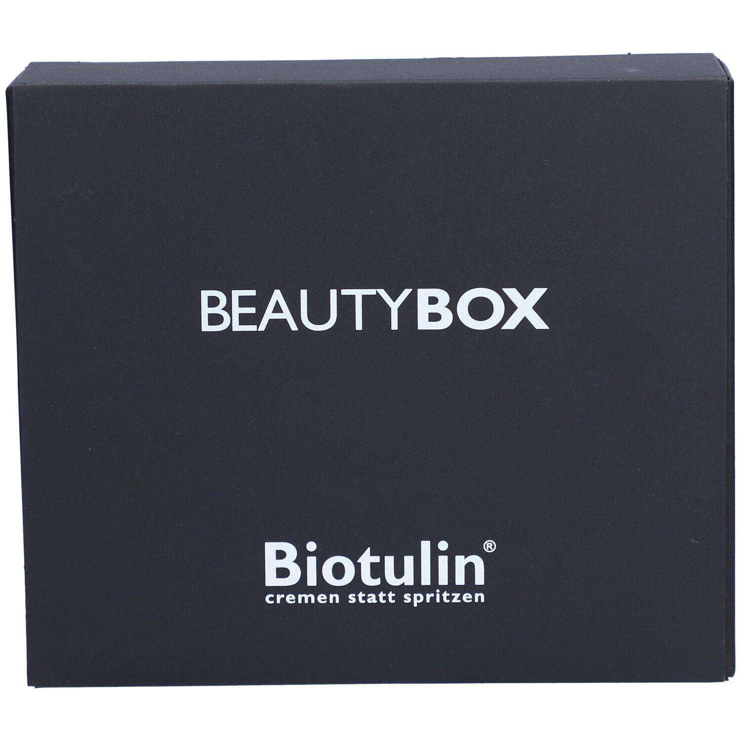 Boîte noire BEAUTYBOX avec logo BIOTULIN et texte blanc. Texte: cremen statt spritzen.