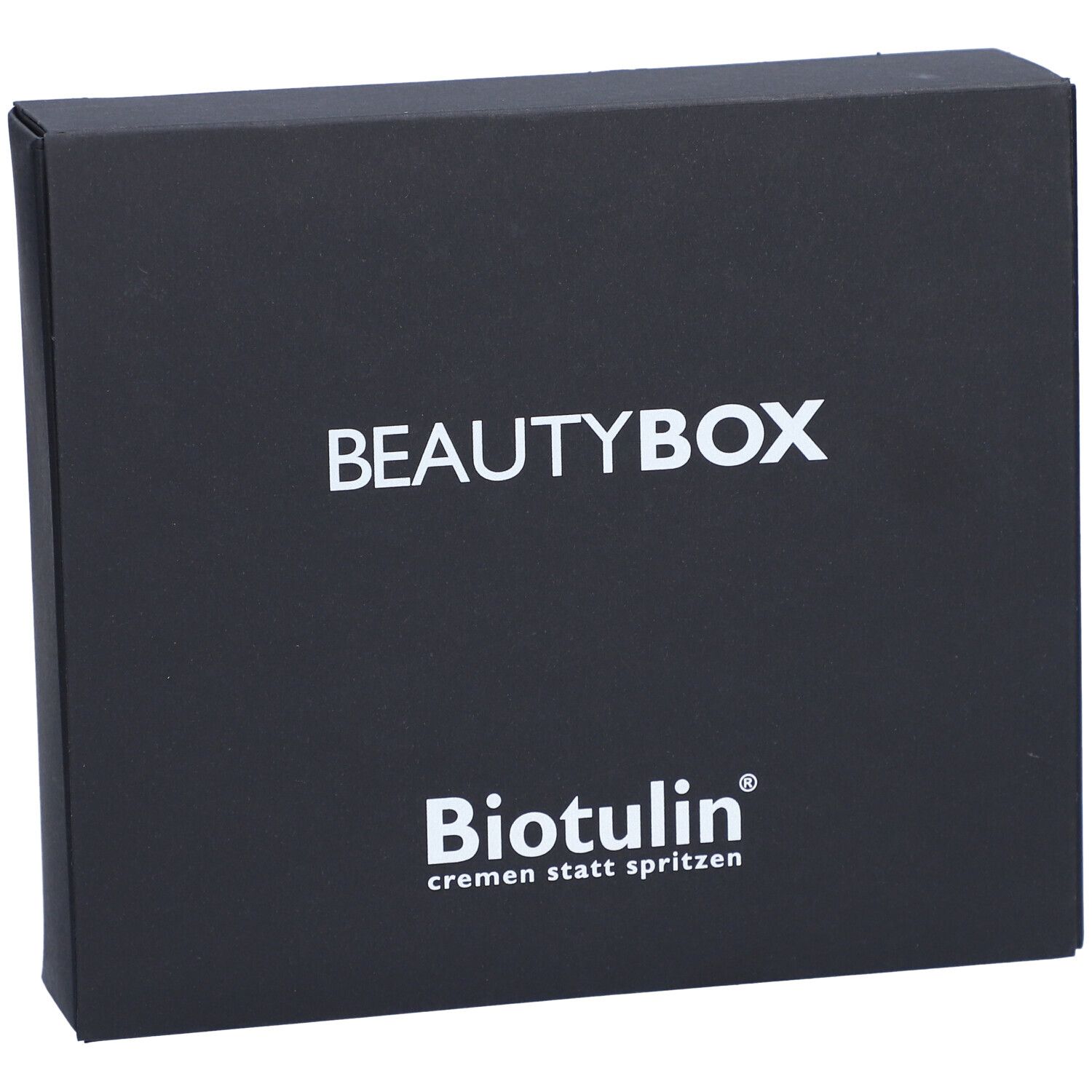 Boîte noire BEAUTYBOX avec logo BIOTULIN et texte blanc. Texte: cremen statt spritzen.