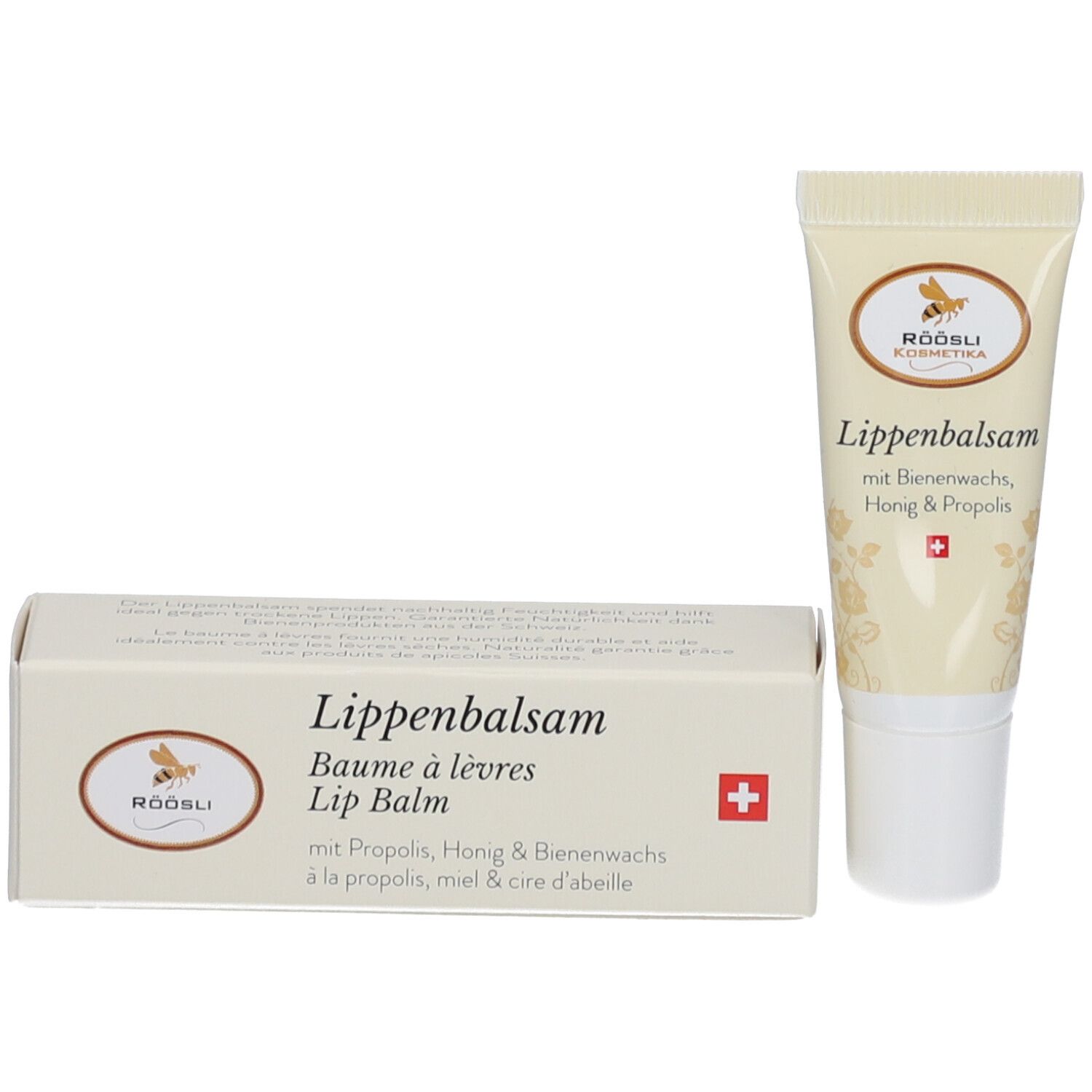 Tube et boîte de baume à lèvres. Inscription: Baume à lèvres, Lip Balm. Croix suisse. RÖÖSLI Kosmetika.