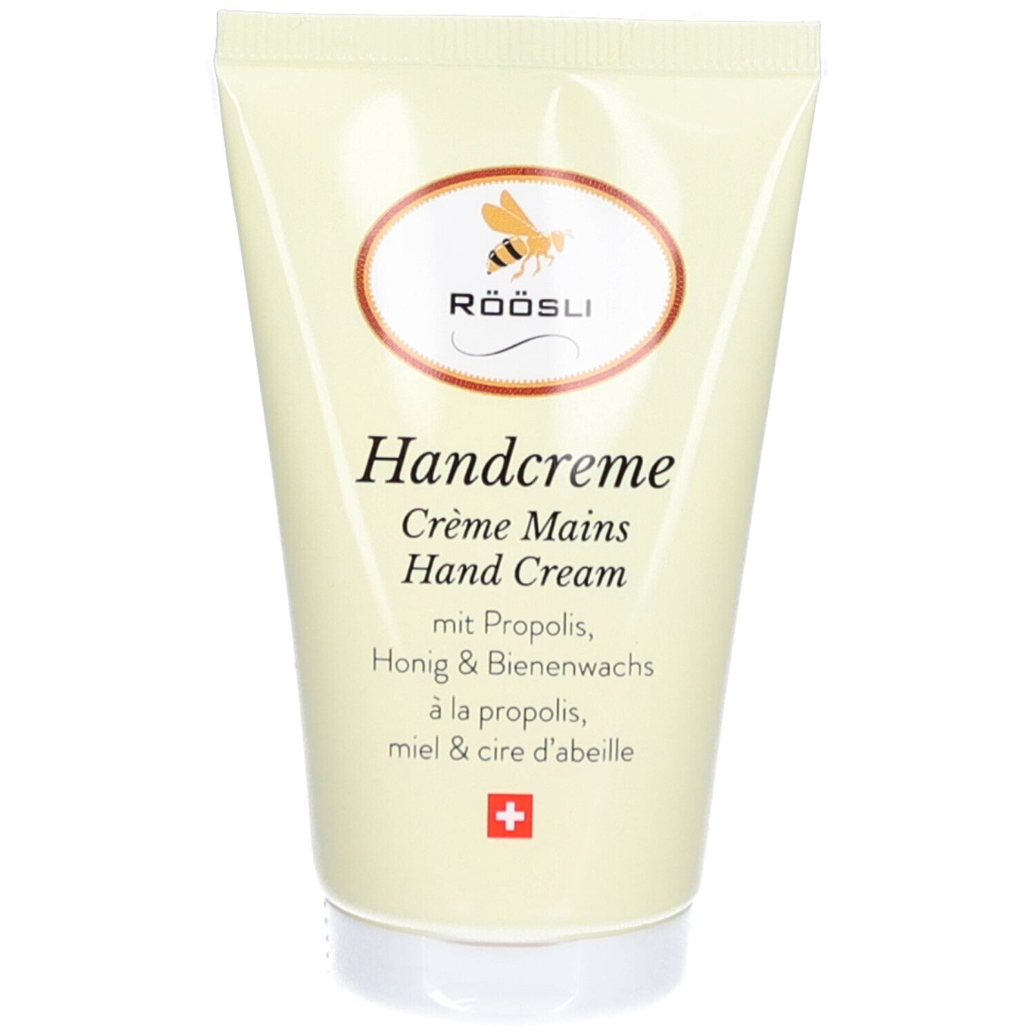 Tube de crème avec logo et texte Handcreme. Contient de la propolis, du miel et de la cire d'abeille. Croix suisse.