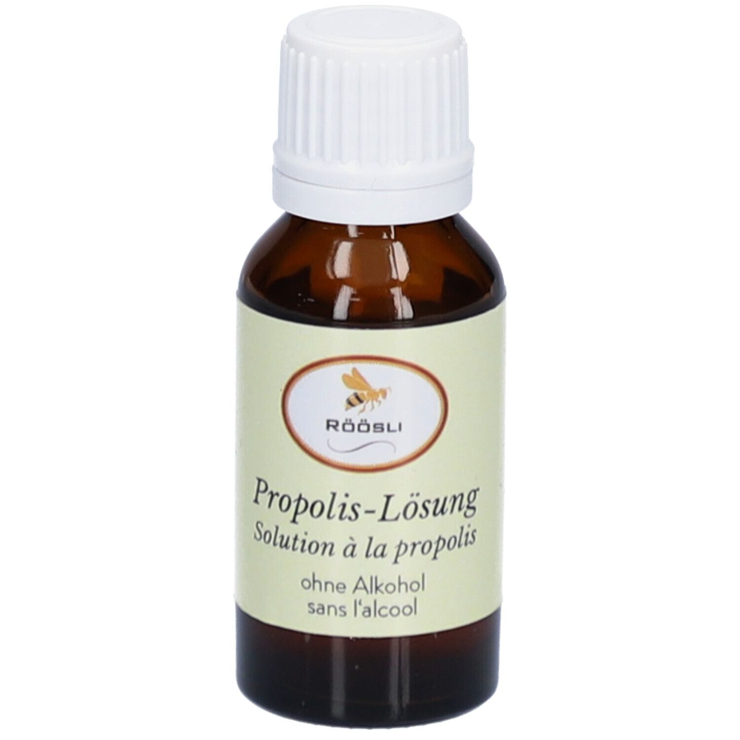 Bruine glazen fles met witte dop. Etiket met productnaam, merk RÖÖSLI en zonder alcohol. Oplossing.