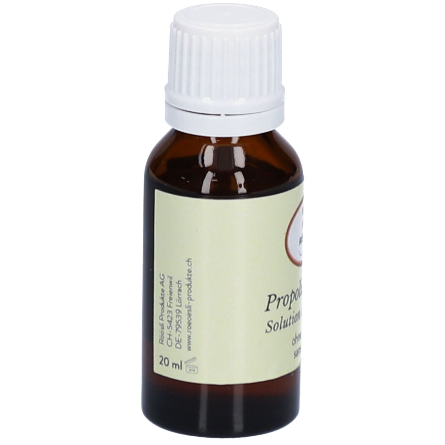 Bruine glazen fles met witte dop. Etiket met productnaam, merk RÖÖSLI, zonder alcohol en adres van de fabrikant.