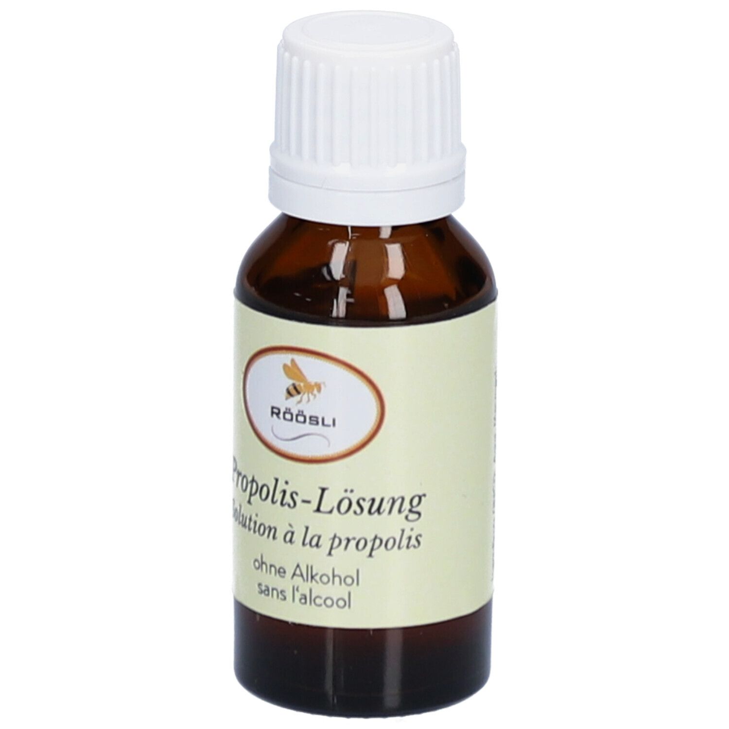 Bruine glazen fles met witte dop. Etiket met productnaam, merk RÖÖSLI en zonder alcohol. Oplossing.