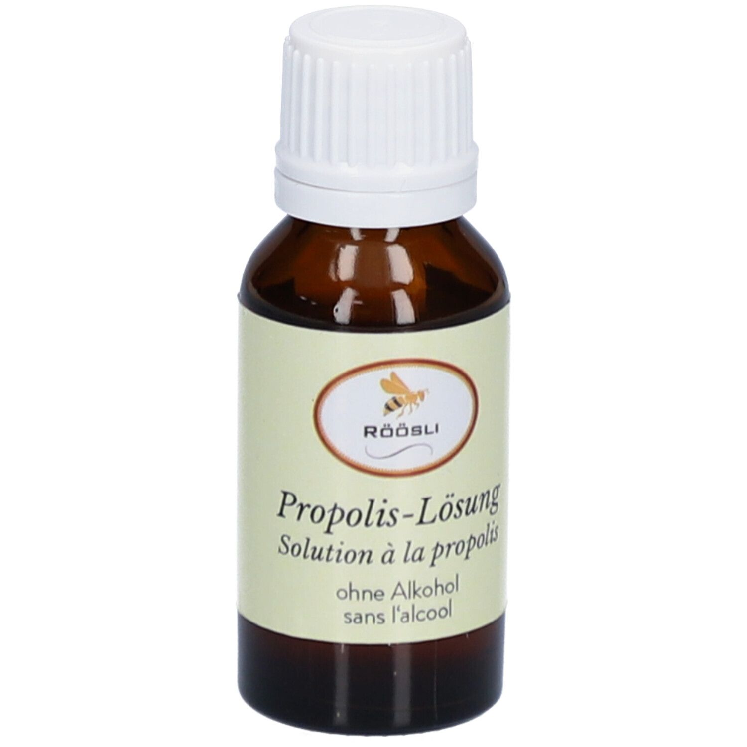 Bruine glazen fles met witte dop. Etiket met productnaam, merk RÖÖSLI en zonder alcohol. Oplossing.