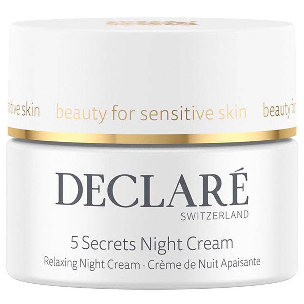 Pot blanc avec couvercle doré. Inscription : DECLARÉ, 5 Secrets Night Cream. Texte : Relaxing Night Cream, Crème de Nuit Apaisante.