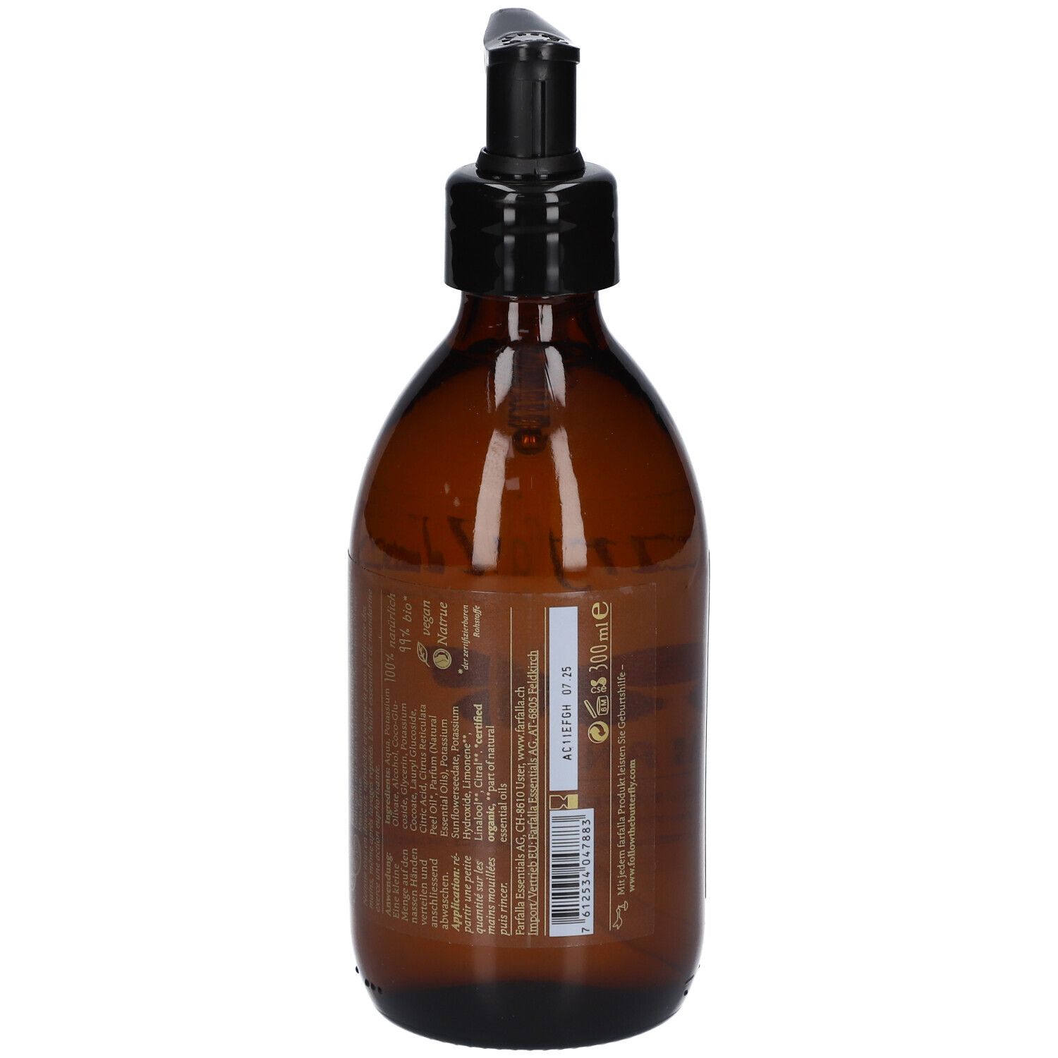 Flacon en verre brun avec pompe noire. Dos avec texte. Étiquette avec informations.