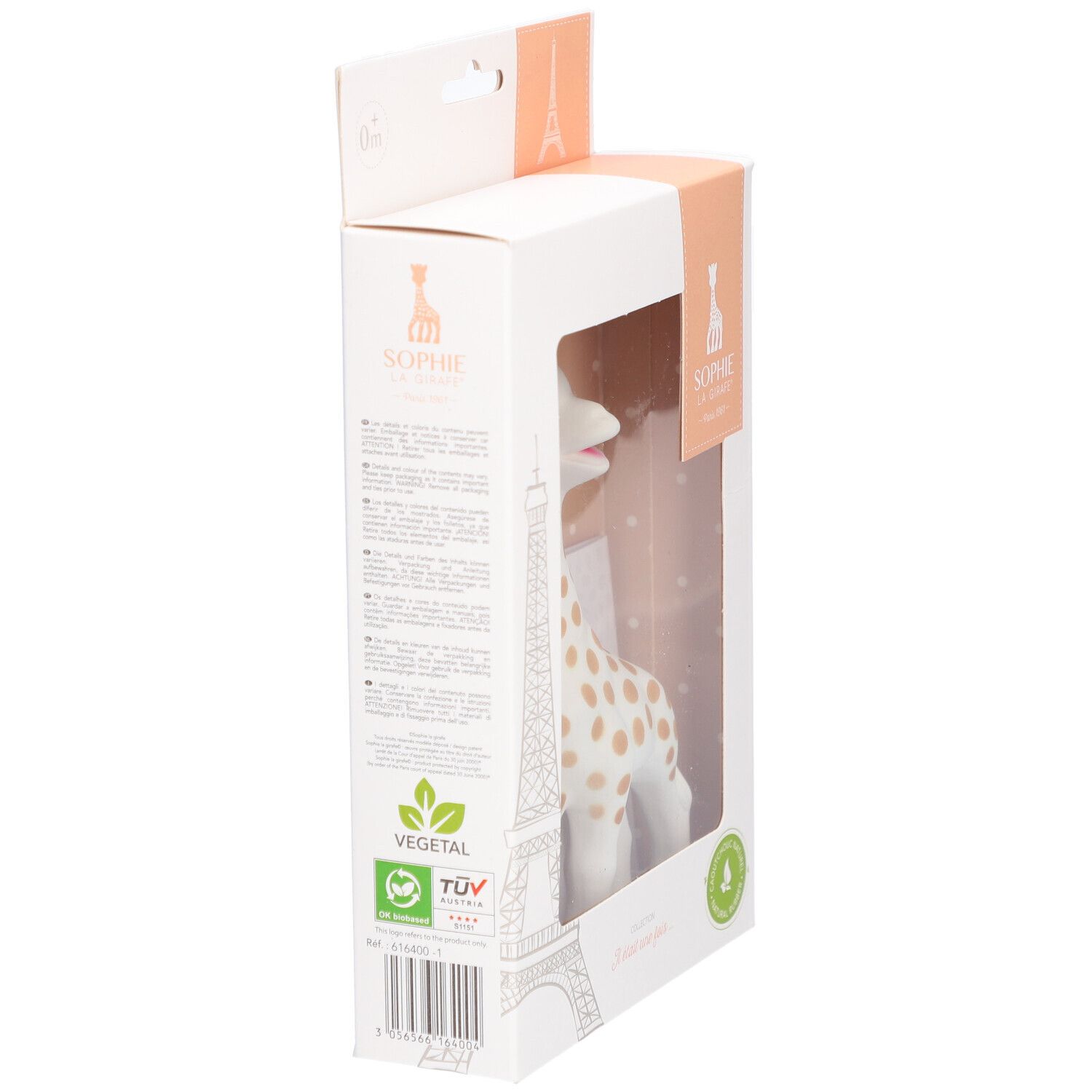 Jouet girafe en boîte, vue latérale. Blanc avec taches marron. Emballage avec logo, texte et certifications.