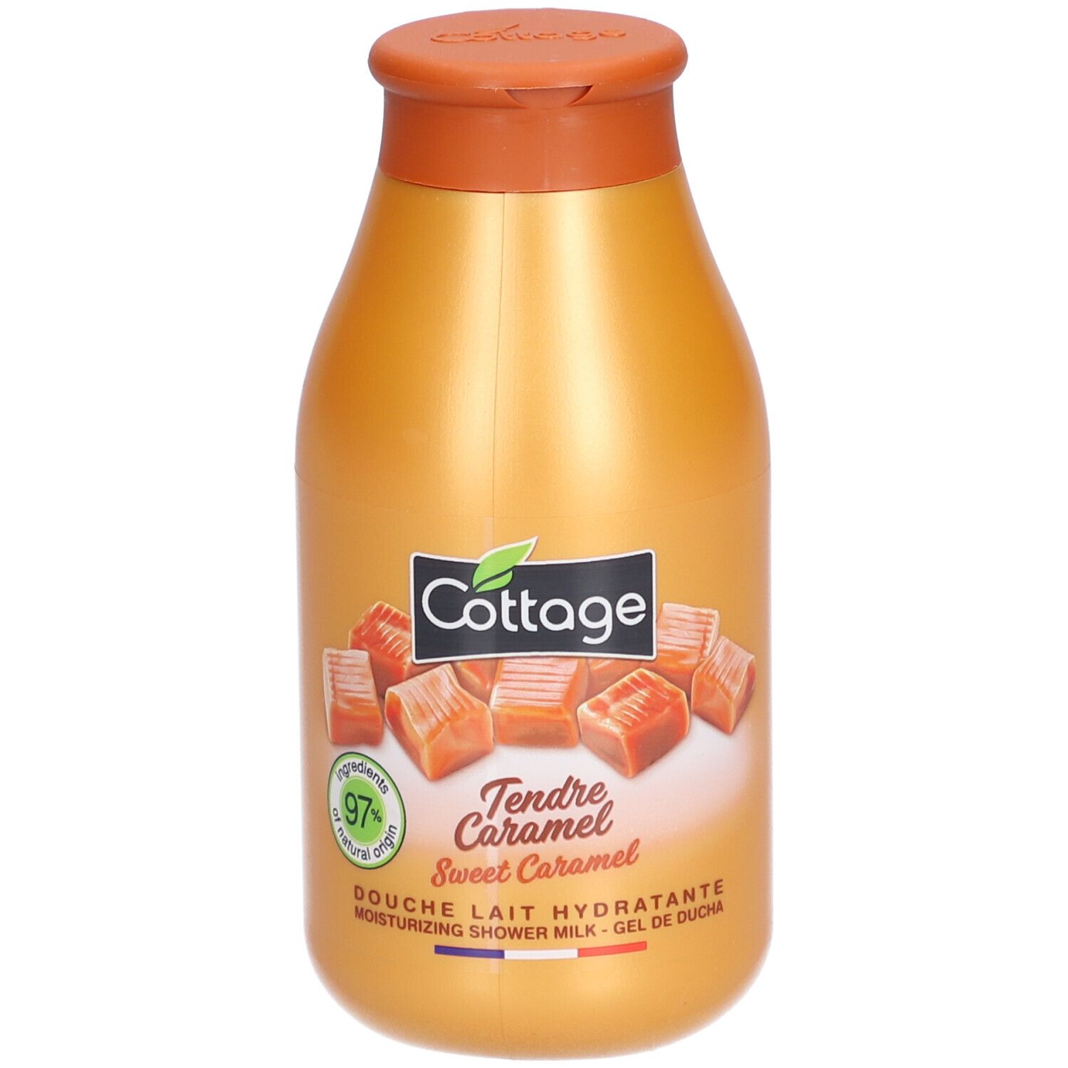 Gouden fles met bruine dop. Opschrift: Cottage, Tendre Caramel, 97% natural origin. Afbeelding van karamel snoepjes.