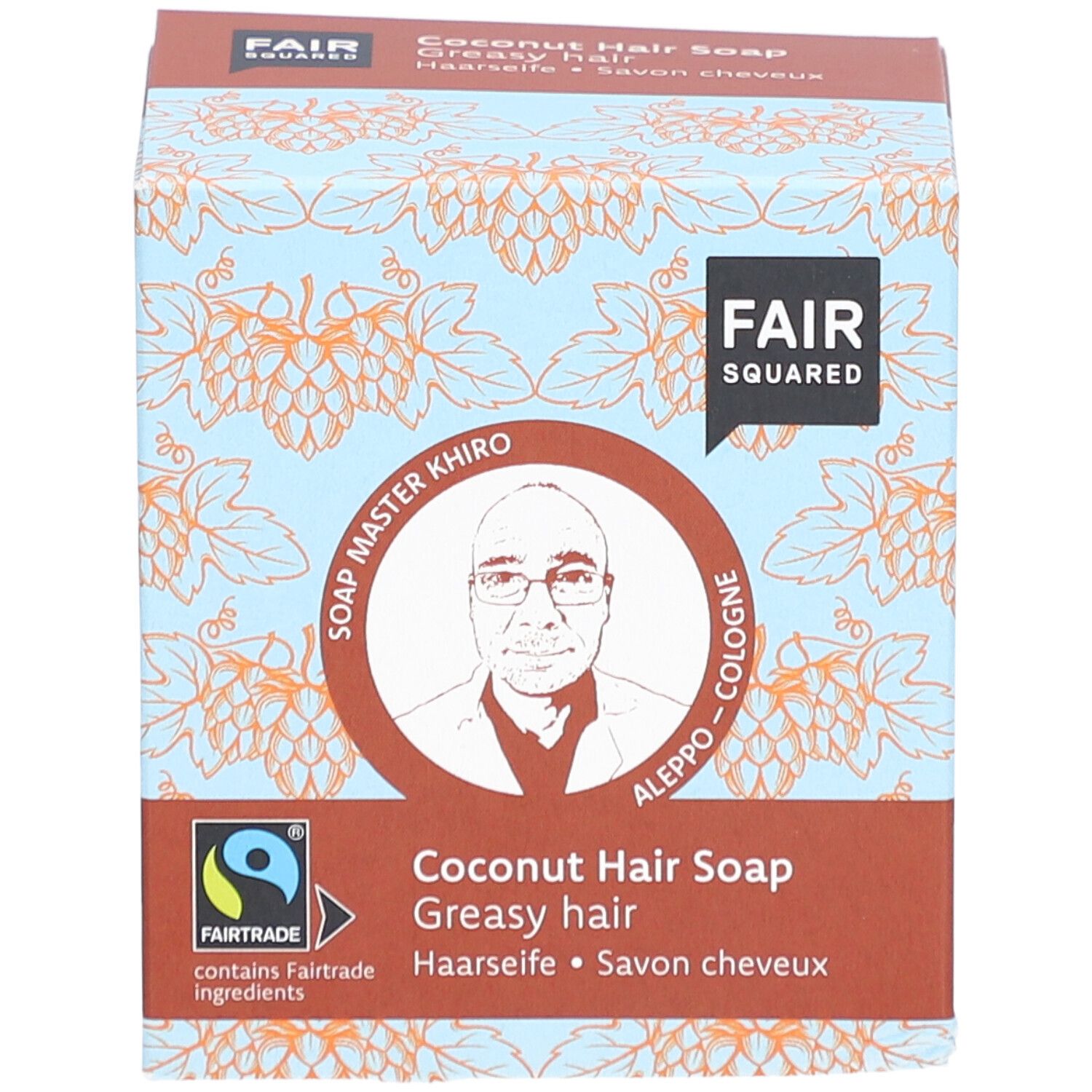 Doosje FAIR SQUARED Haarseife Coco. Opschrift: FAIR SQUARED, Soap Master Khiro, Fairtrade-label, Kokos Haarzeep, voor vet haar.