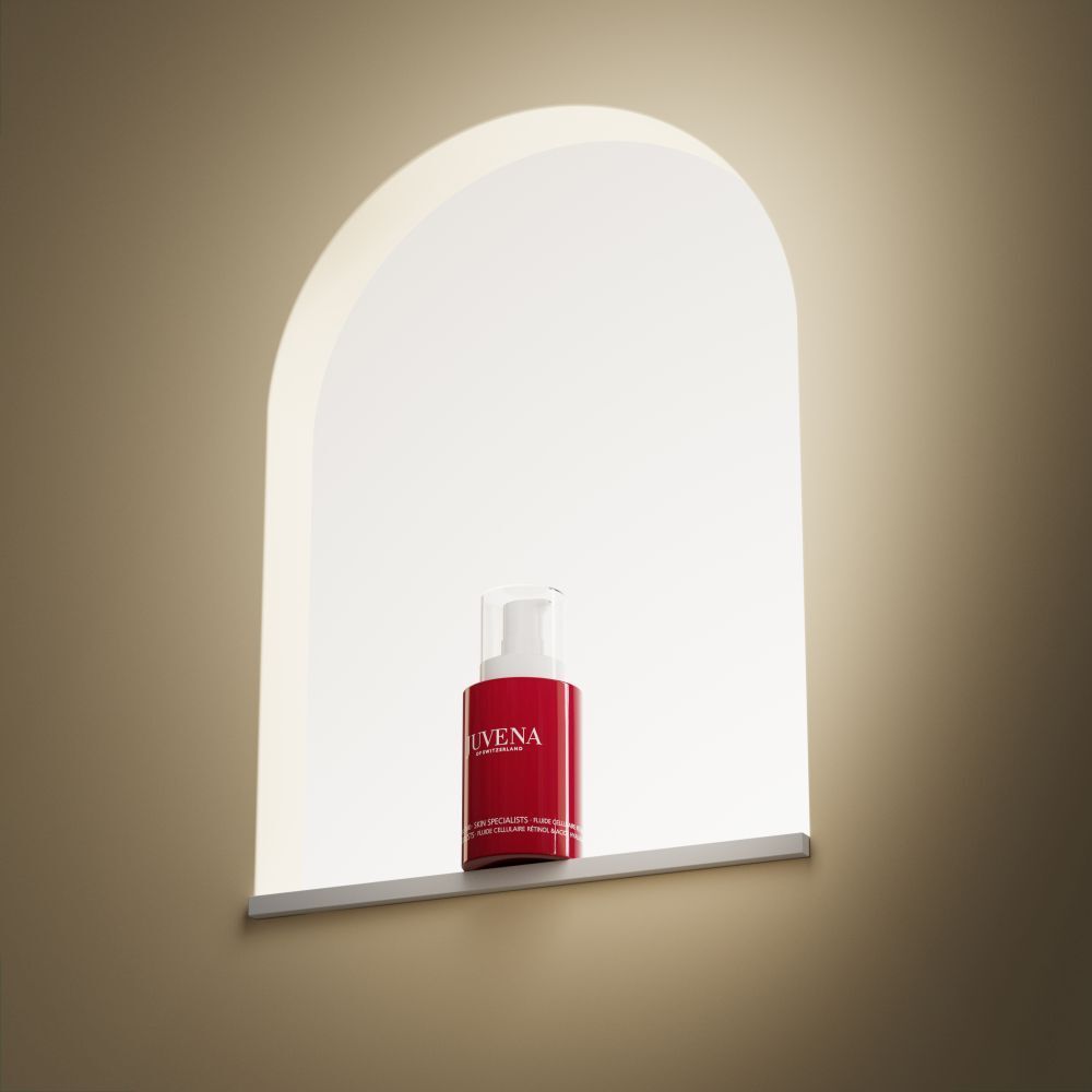 Flacon rouge avec pompe blanche. Inscription: JUVENA. Produit dans une niche avec lumière.