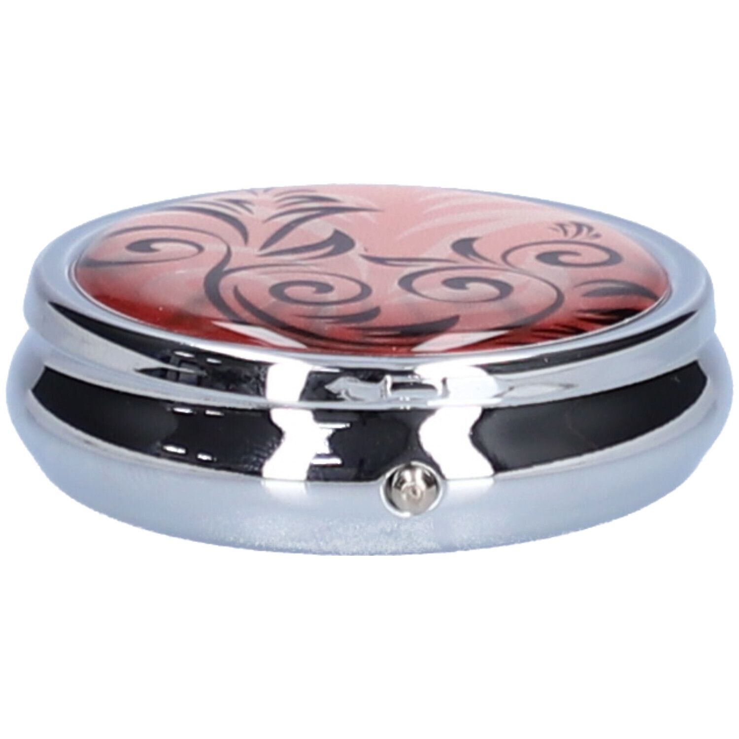 Pilulier rond fermé, couvercle rouge à motifs noirs, corps argenté.