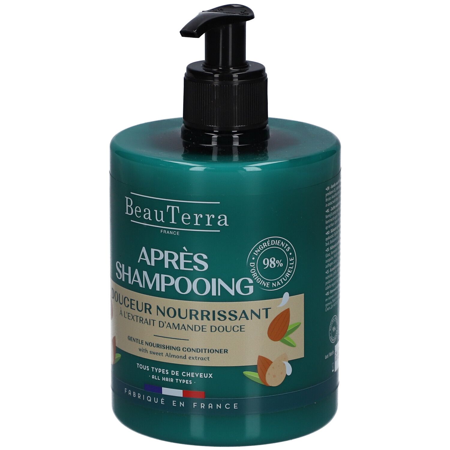 Groene fles met zwarte pomp. Opschrift: Après Shampooing, Douceur Nourrissant, Extrait d'Amande Douce. 98% ingrediënten van natuurlijke oorsprong.