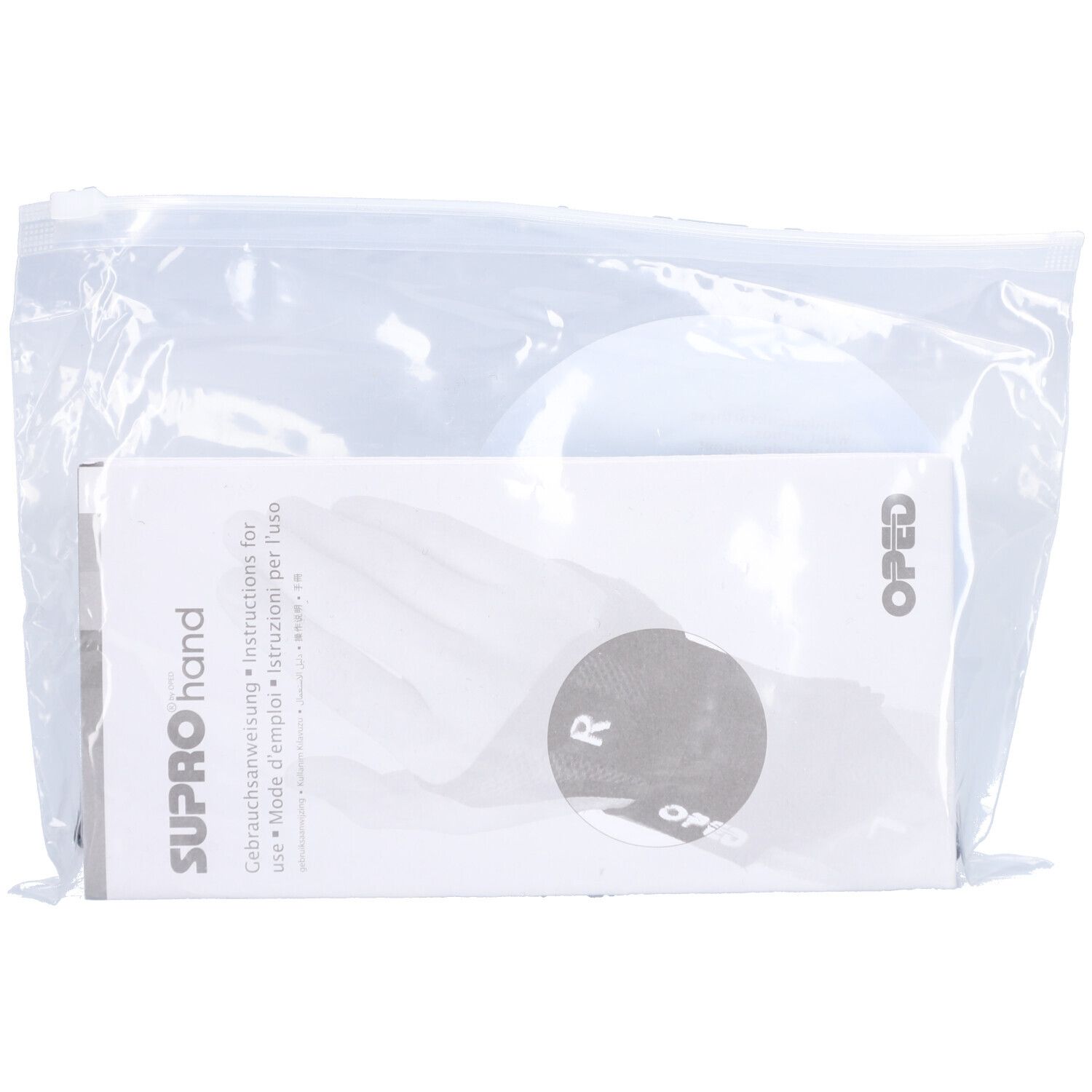 Orthèse de poignet SUPROhand dans un emballage plastique. Notice d'utilisation et logo OPED visibles.