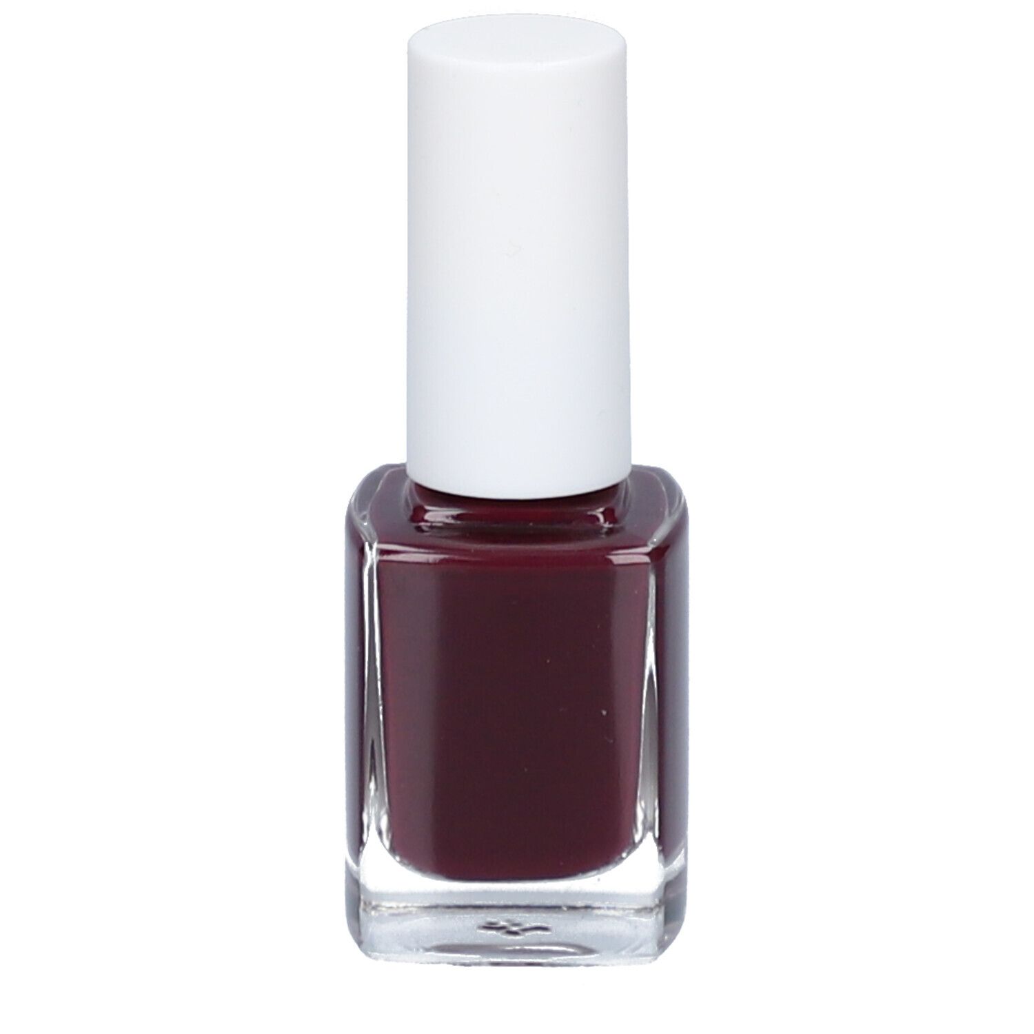 Nagellakfles met witte dop. Donkerrode nagellak in vierkante glazen fles.