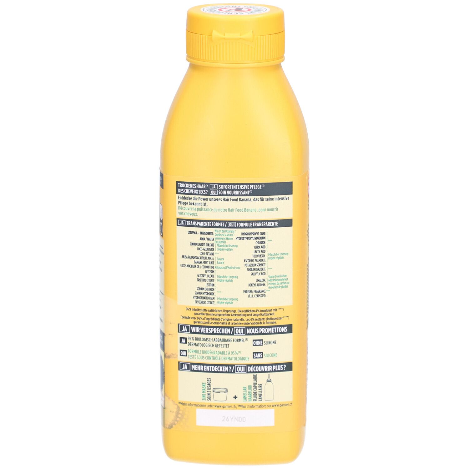 Achterkant van de gele shampoo fles. Tekstsecties met informatie. 350ml.