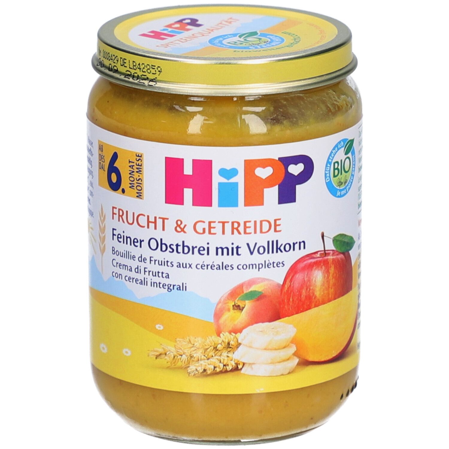 Hipp Fruit & Granen Fijne Fruitpap met Volkoren in een glazen pot met geel deksel.