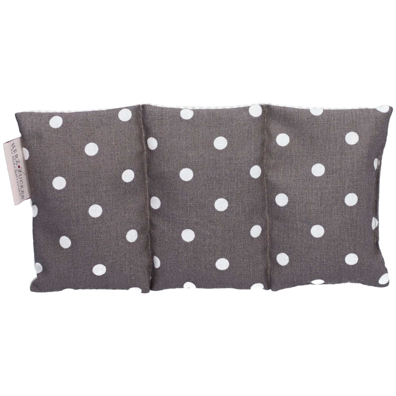 Coussin chauffant gris à pois blancs. Inscription : HERZZUCKER®. Rectangulaire, en trois parties.