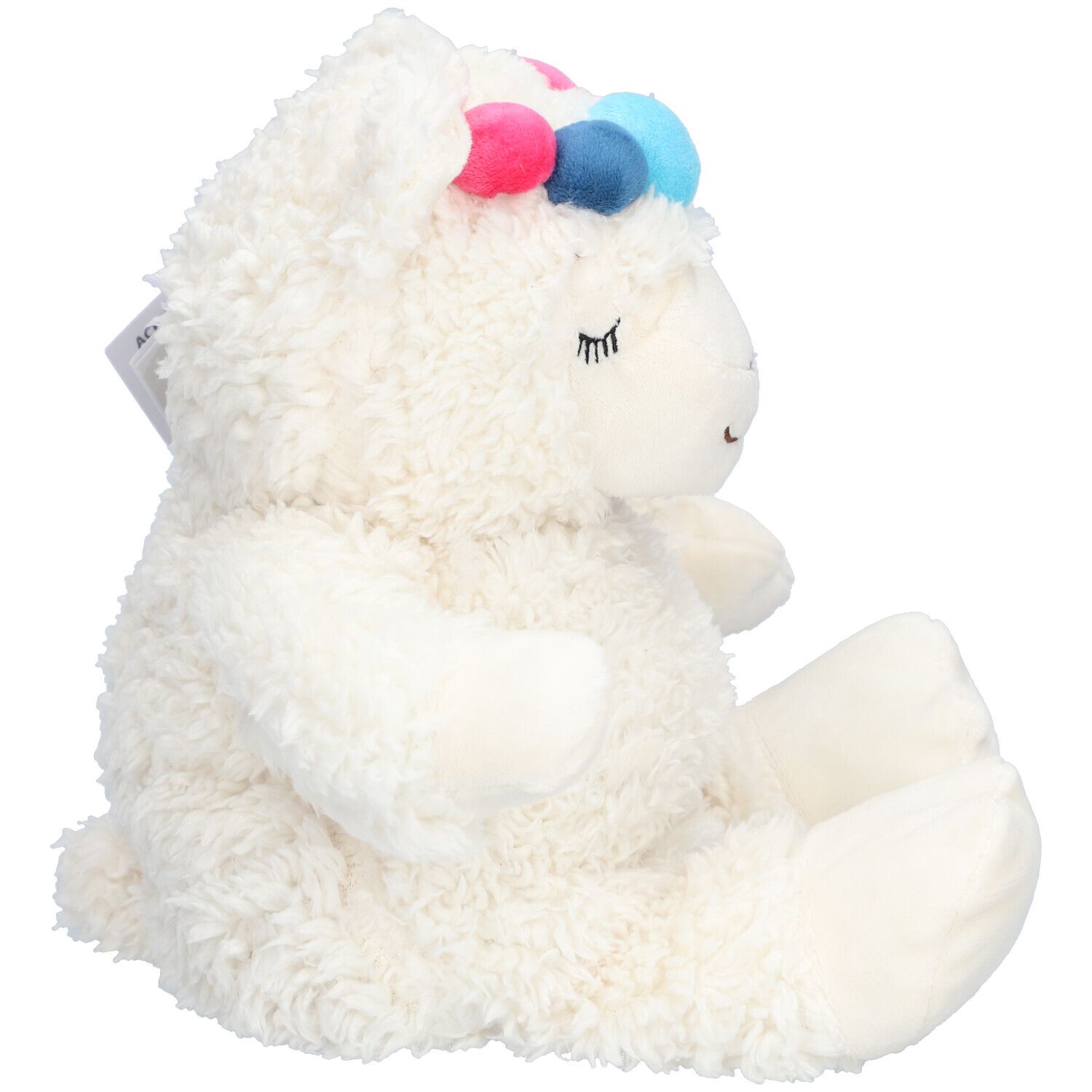 Vue latérale de la peluche alpaga blanche avec pompons. Étiquette avec informations produit.