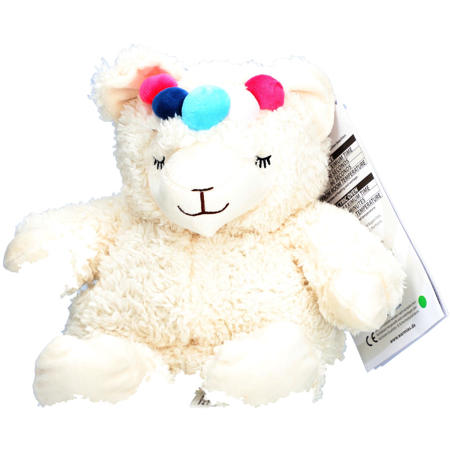 Peluche alpaga blanc avec pompons colorés sur la tête. Étiquette avec informations produit.