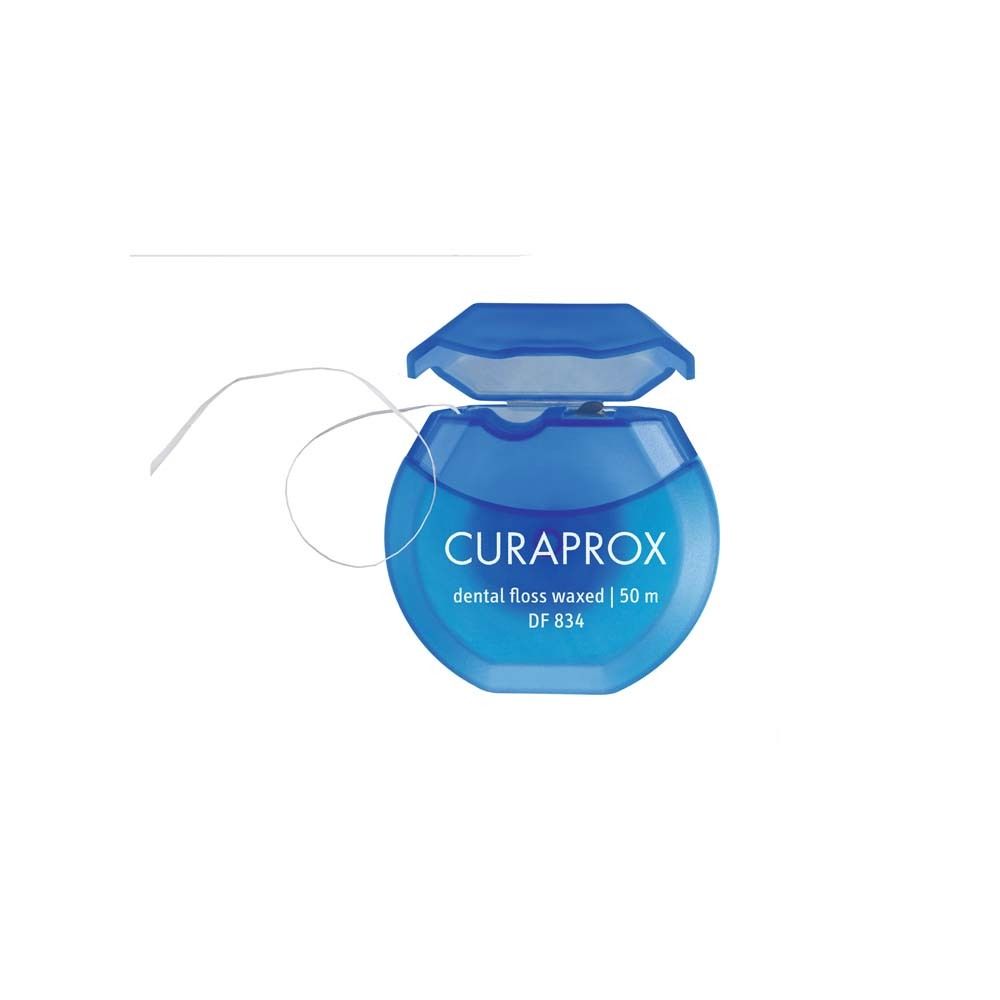 Blauwe tandenpoetsdraad met open deksel. Merk CURAPROX, tekst "dental floss waxed".