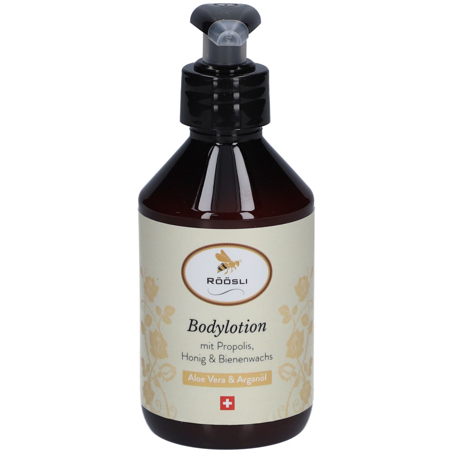 Flacon brun avec pompe noire. Étiquette avec texte: Bodylotion, Aloe Vera & Arganöl, croix suisse.