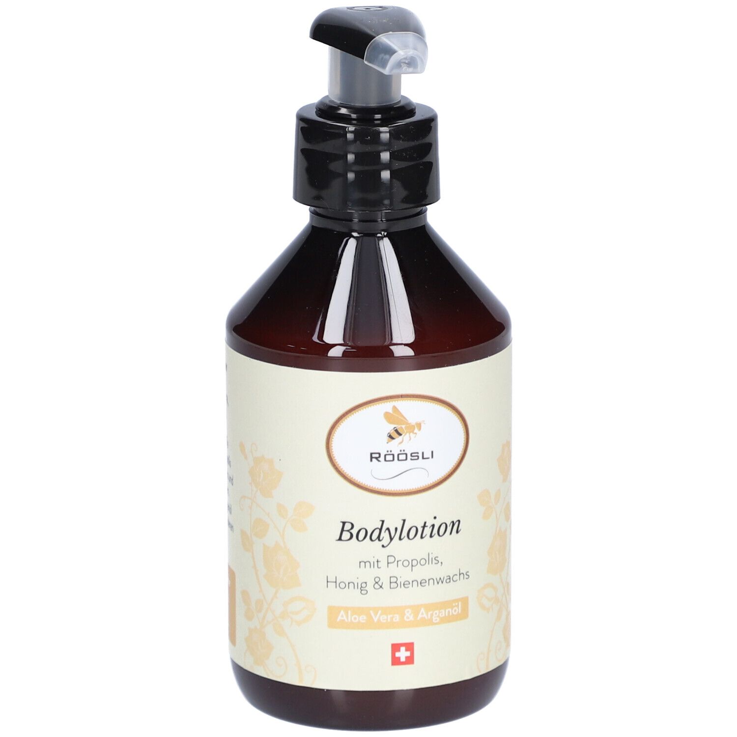 Flacon brun avec pompe noire. Étiquette avec texte: Bodylotion, Aloe Vera & Arganöl, croix suisse.