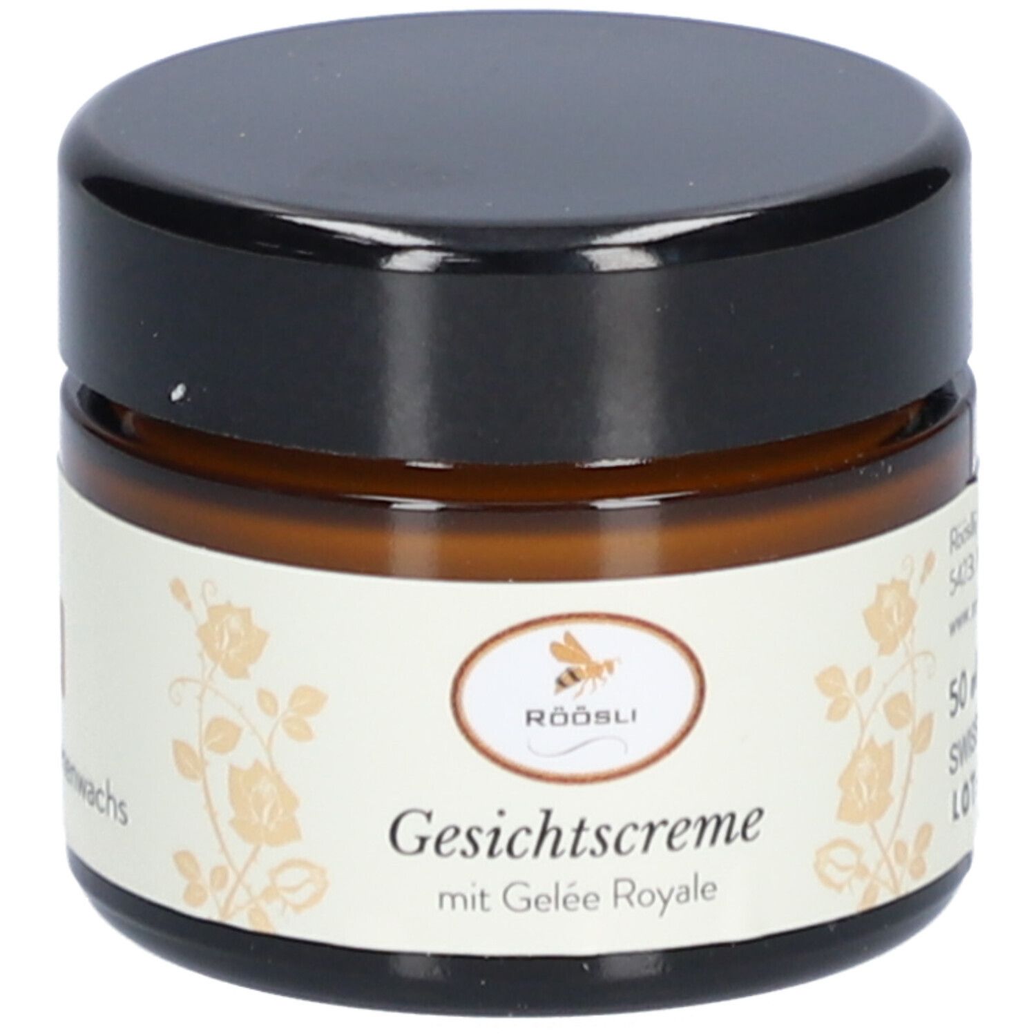 Bruine glazen pot met zwarte deksel. Label: Röösli, Crème visage met Gelée Royale.