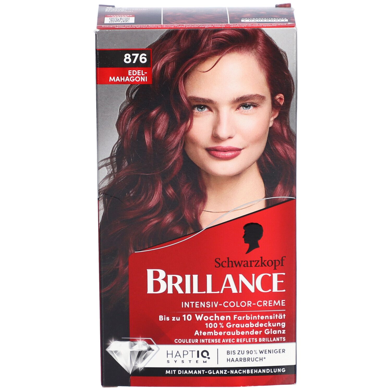 Voorkant van de Brilliance 876 Edelmahagoni-verpakking. Rode doos met vrouwengezicht. Schwarzkopf Brilliance-opschrift.