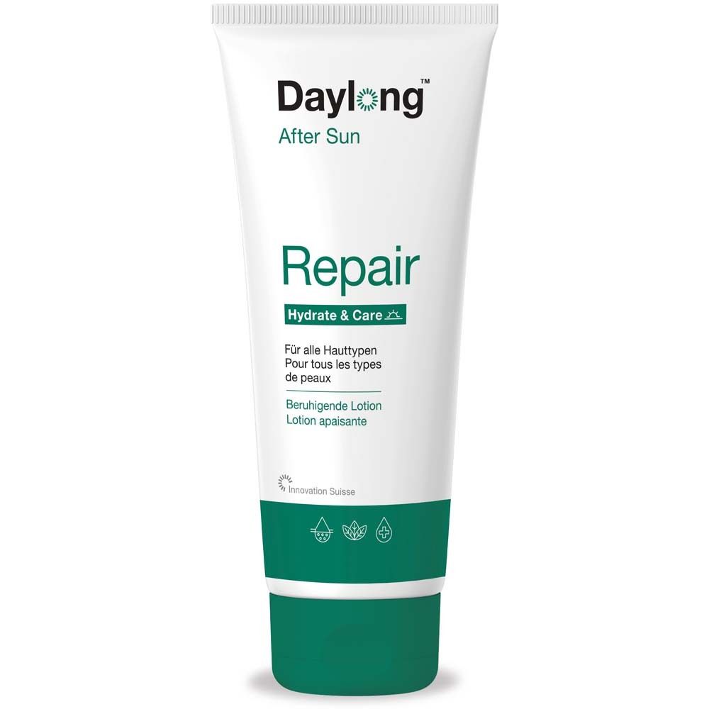Witte tube met groene dop. Opschrift: Daylong After Sun Repair. Voor alle huidtypen. Verzachtende lotion.