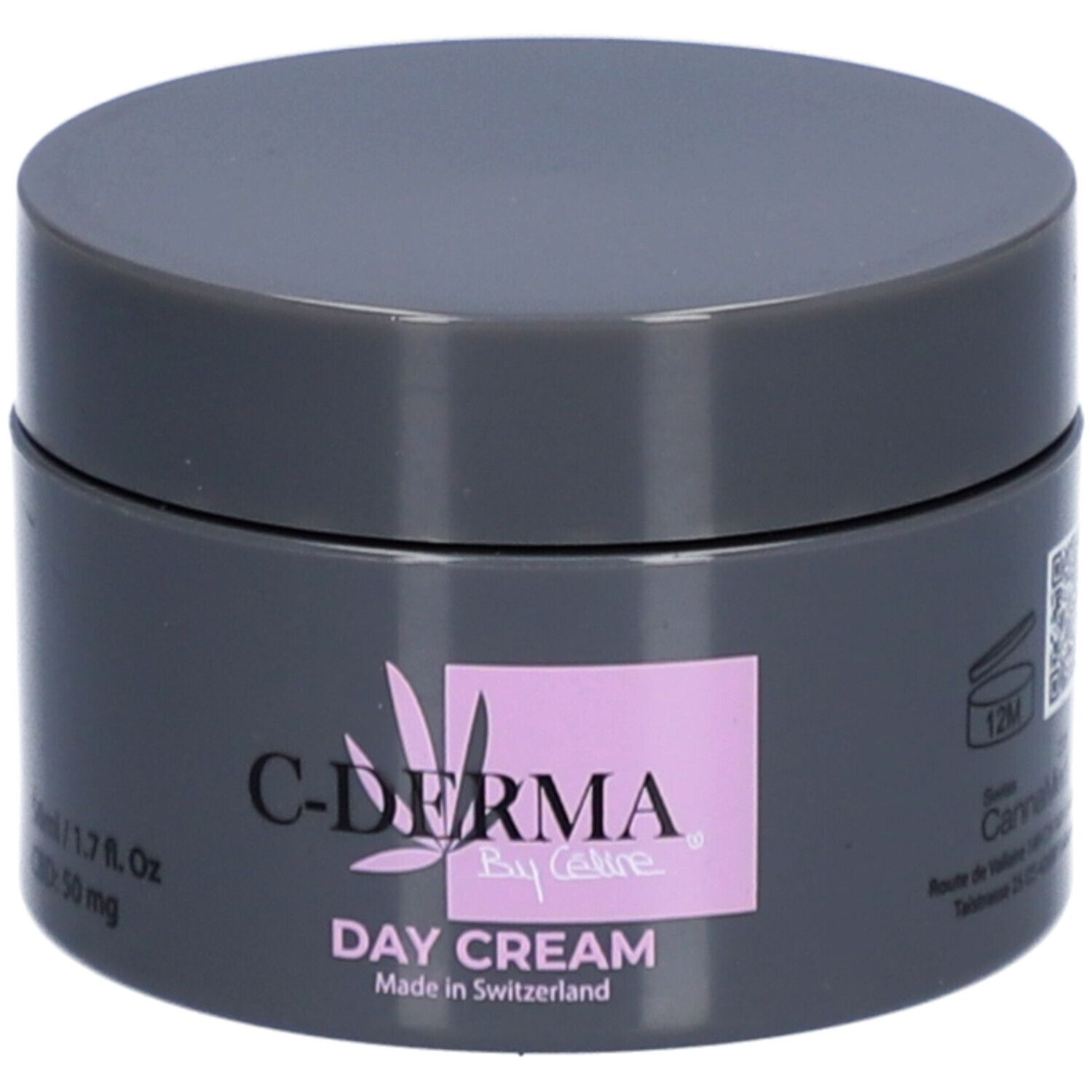 Pot gris foncé avec couvercle. Inscription : C-DERMA By Celine, Day Cream, Made in Switzerland. Carré rose avec logo.