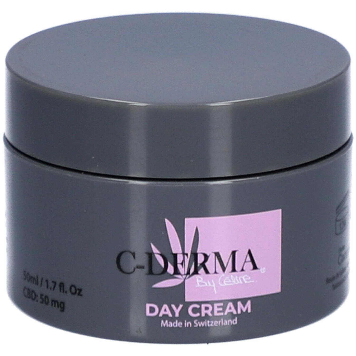 Pot gris foncé avec couvercle. Inscription : C-DERMA By Celine, Day Cream, Made in Switzerland. Carré rose avec logo.