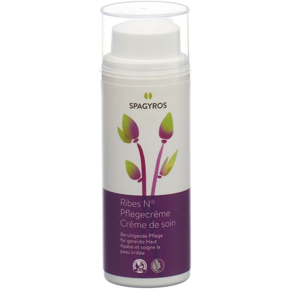 Flacon de crème avec nom et logo du produit. Emballage violet et blanc. Texte: Ribes N® Pflegecreme, Crème de soin. Soin apaisant pour peaux irritées.