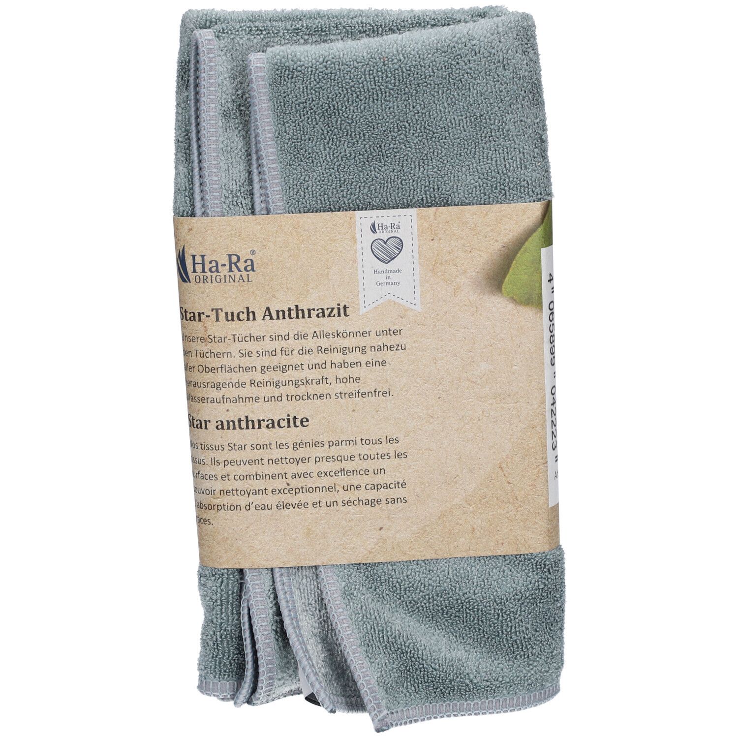 Lingettes anthracite emballées. Logo Ha-Ra et nom Star-Tuch visibles. Bande de papier avec texte et symbole de cœur.